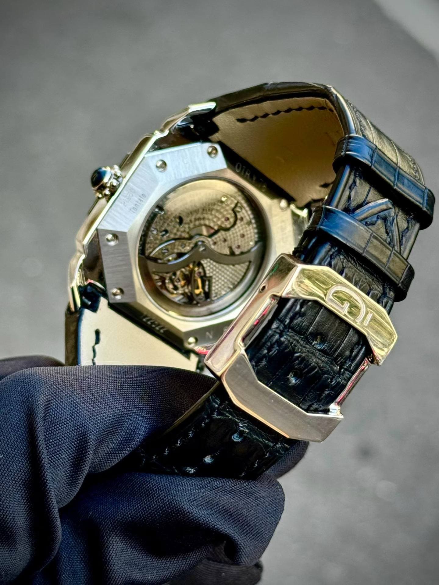 May be an image of wrist watch and text