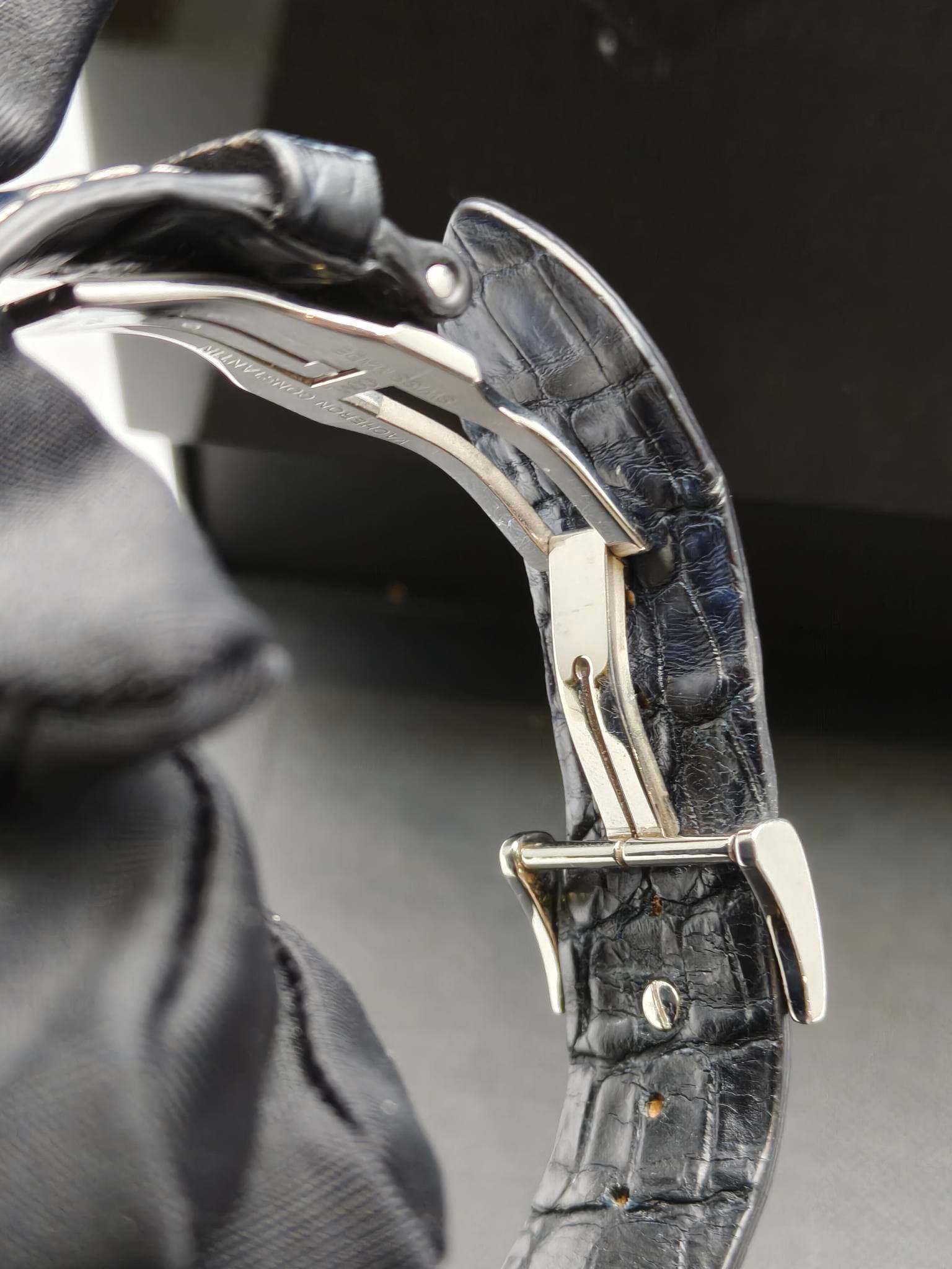 May be an image of wrist watch and text