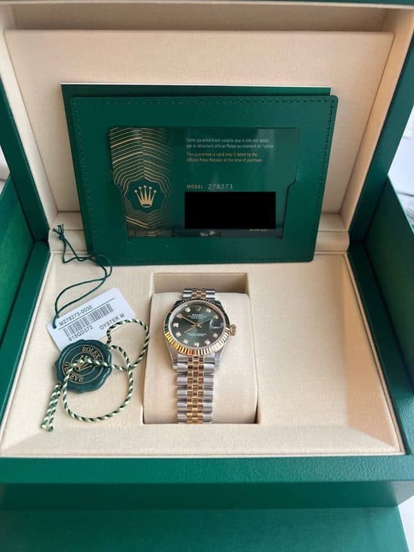 May be an image of wrist watch and text that says 'eo tante MODEL278273 M278273- 8150D372 OYSTERM @ a f 3'