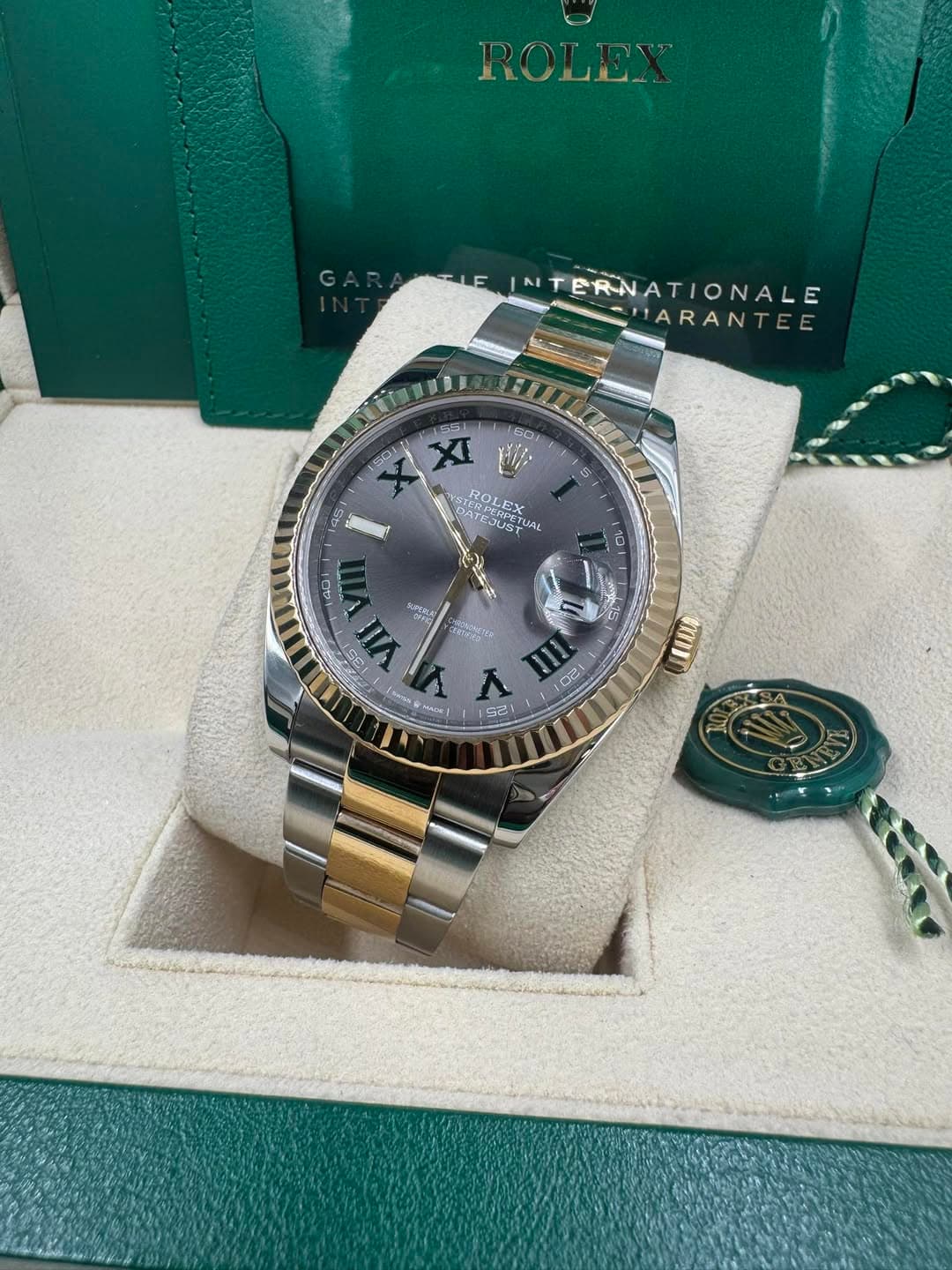 May be an image of wrist watch and text