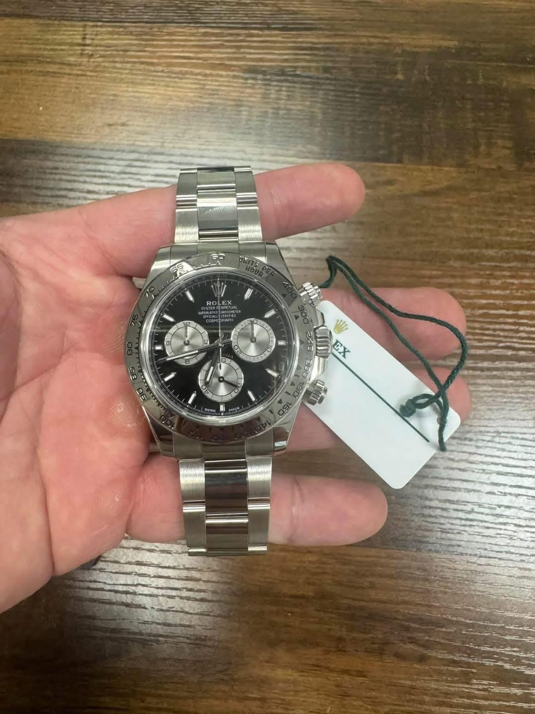 May be an image of wrist watch and text