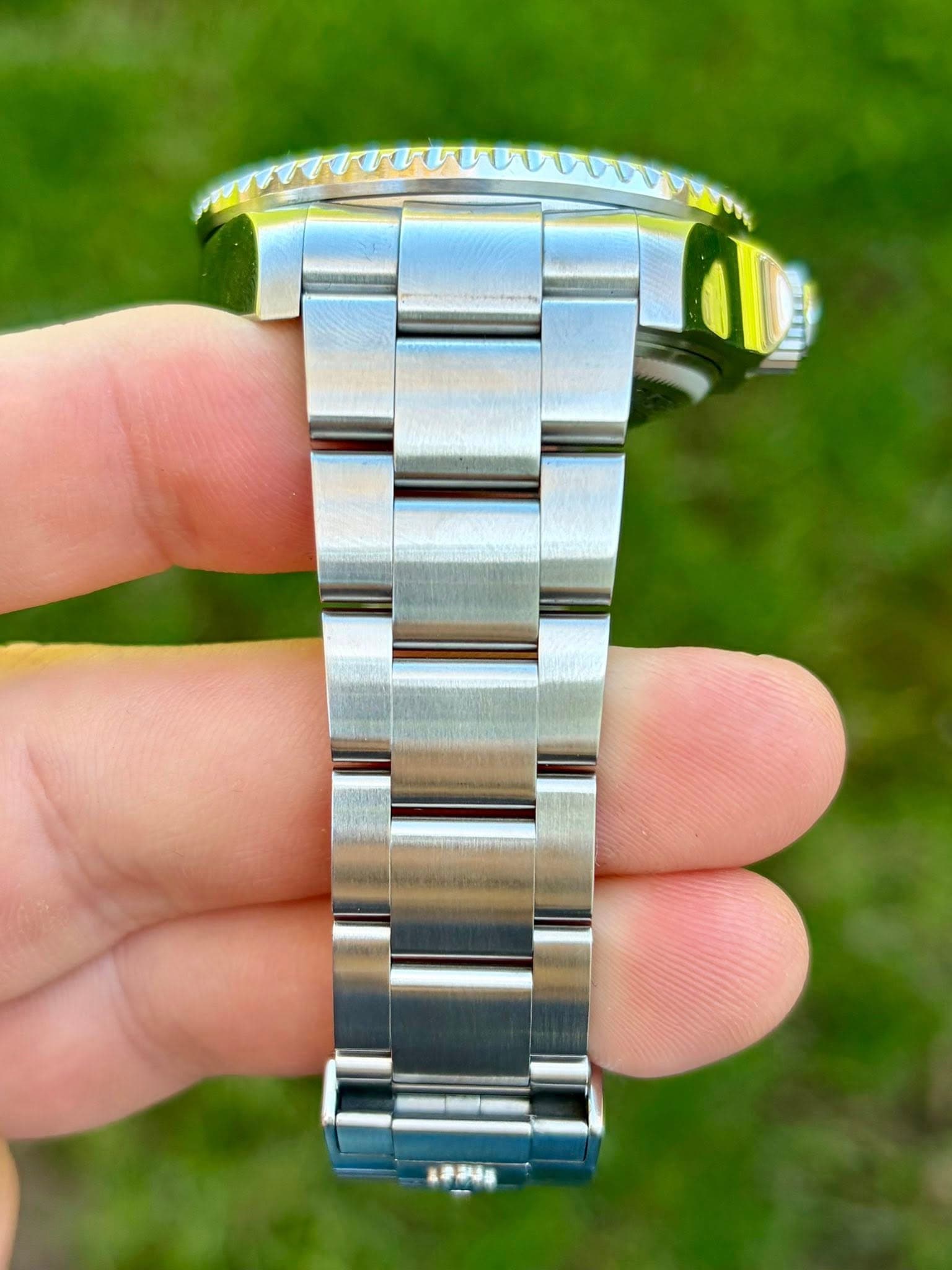 May be an image of wrist watch and text