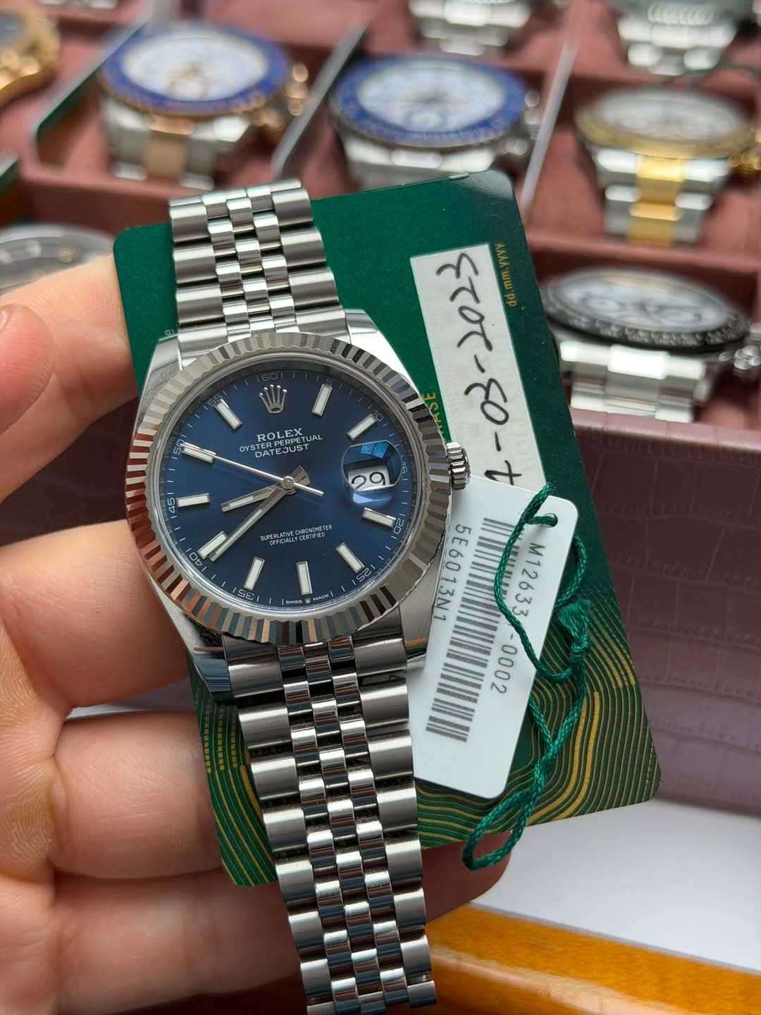 May be an image of wrist watch and text