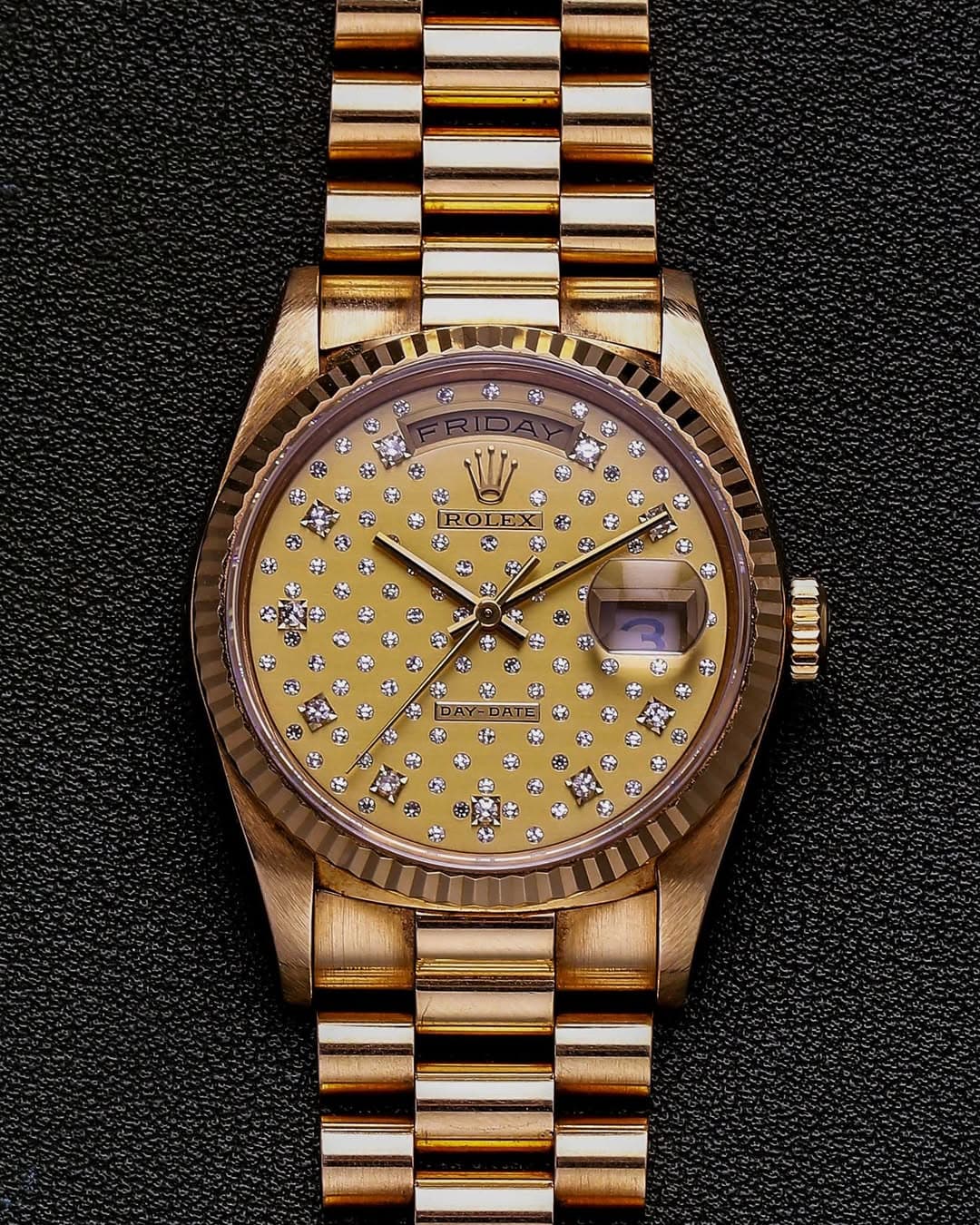 May be an image of wrist watch and text