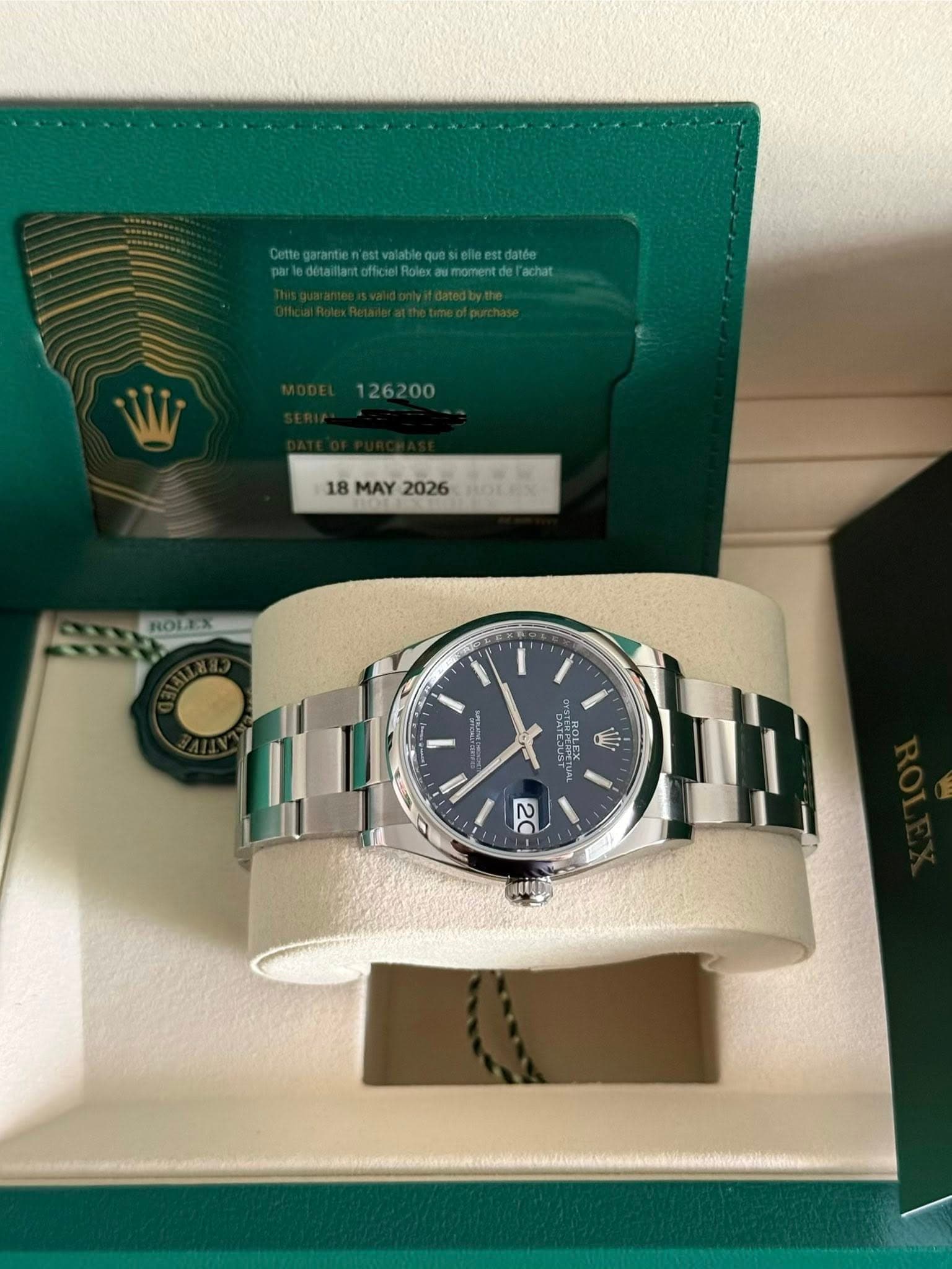 May be an image of wrist watch and text