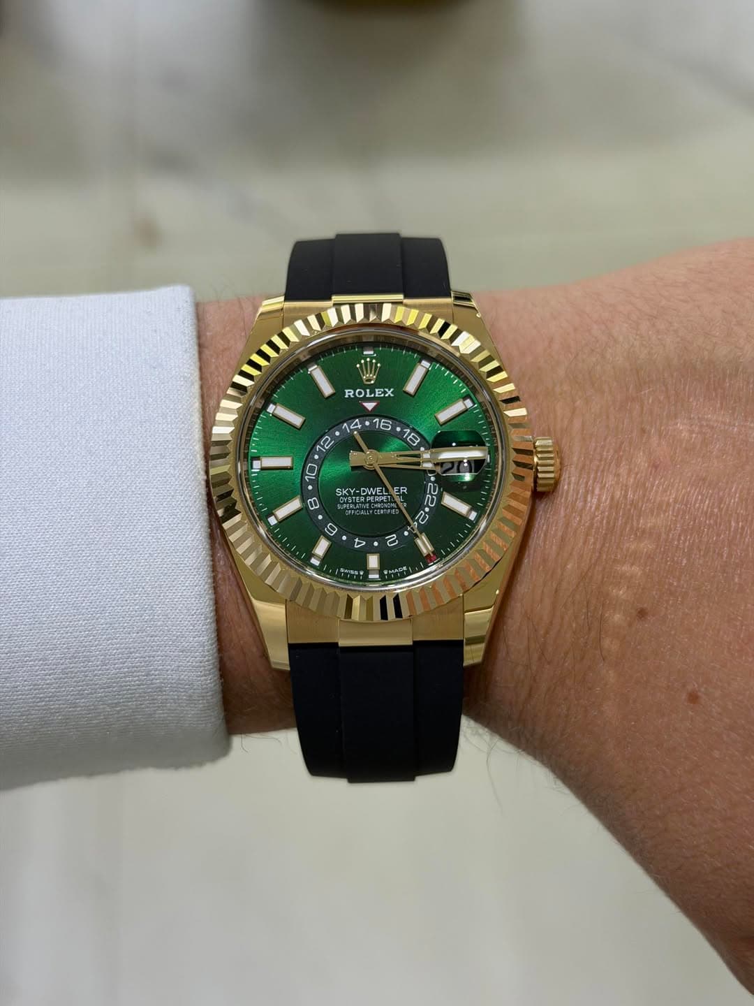 May be an image of wrist watch and text