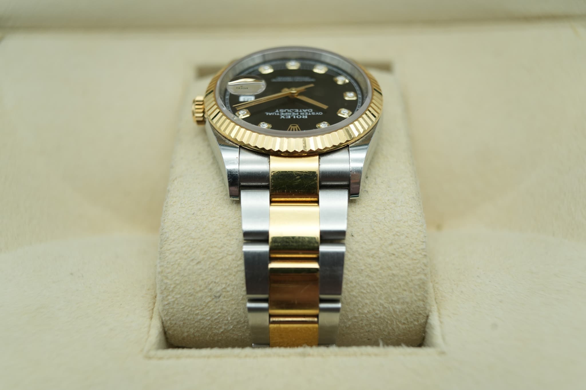 May be an image of wrist watch and text