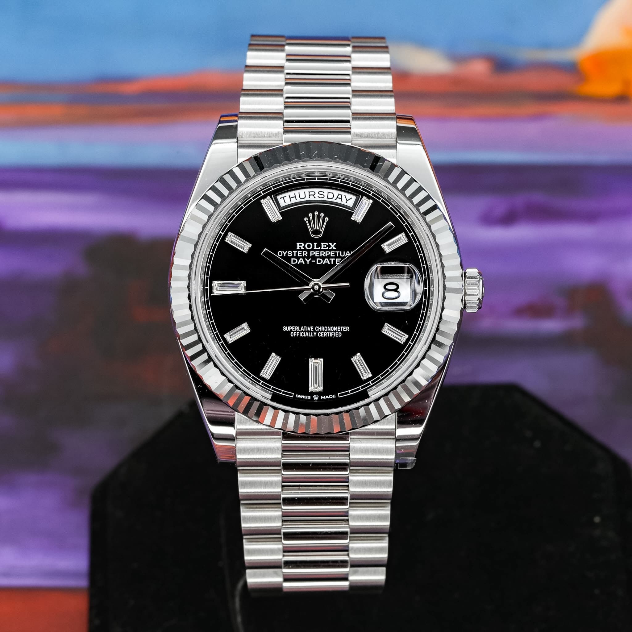 May be an image of wrist watch and text