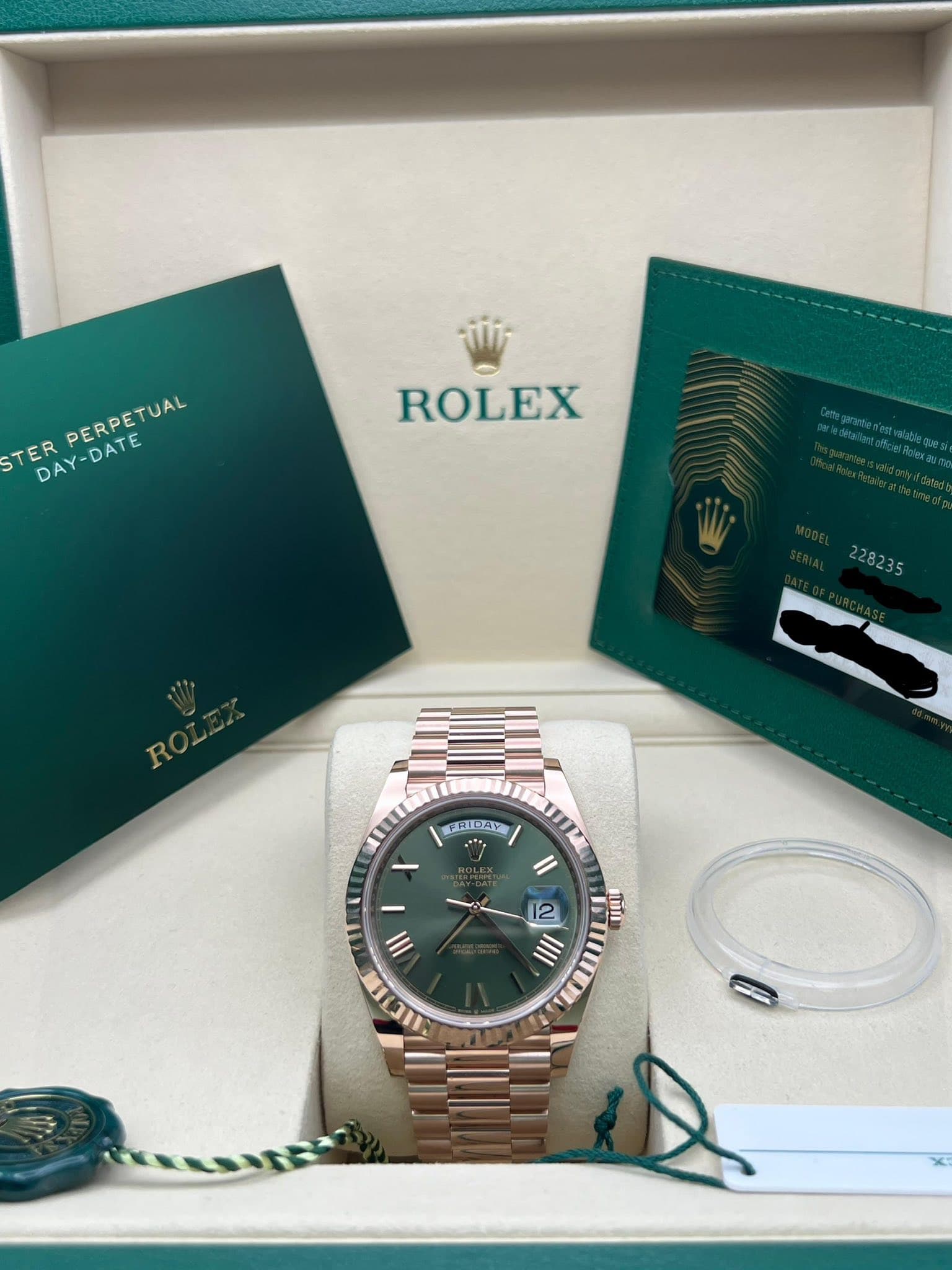 May be an image of wrist watch and text that says 'STER TERPERETUAL DAY-DATE DAY-DATE PERPETUAL PERPETUAL ROLEX 228235 KHI THIPAY JAXZ Il tmi 12 I1 I/I1 III HCT'