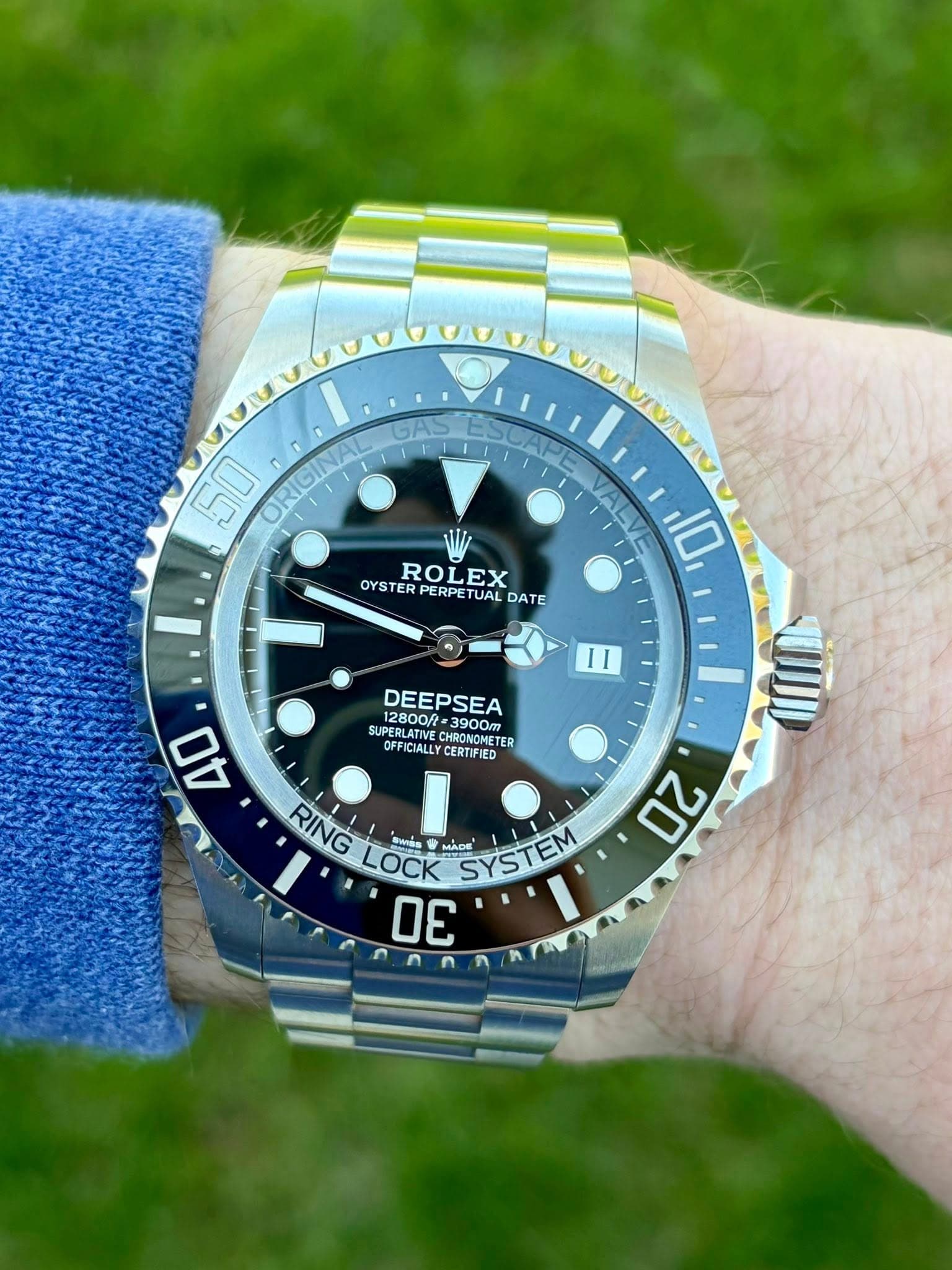 May be an image of wrist watch and text