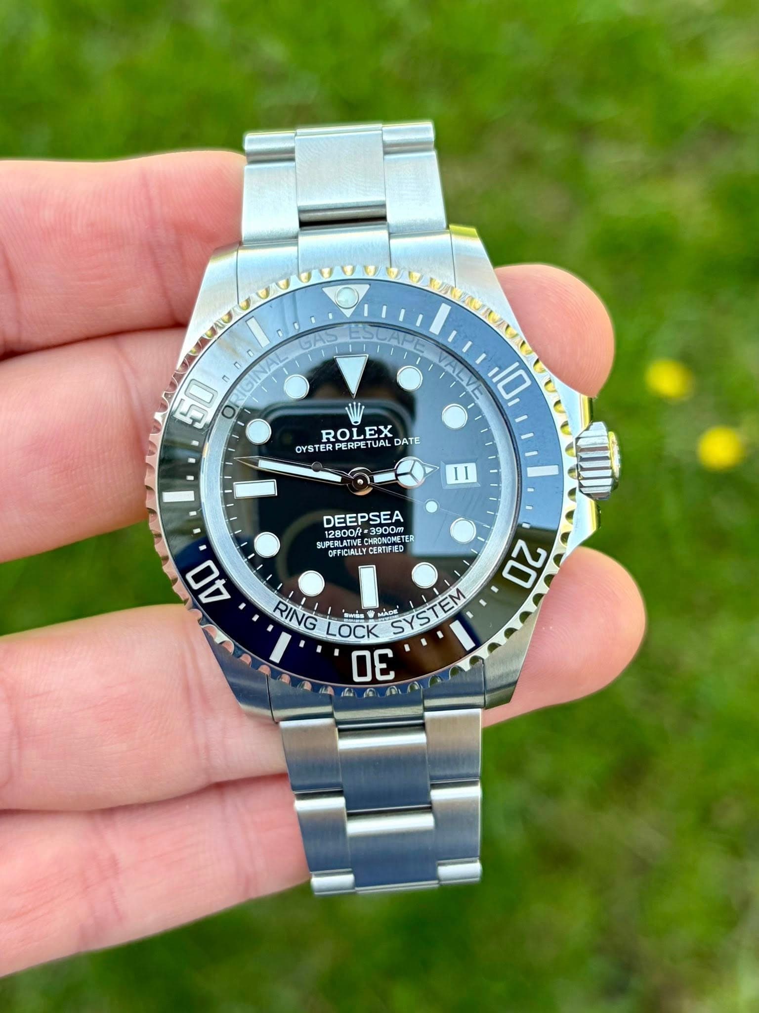 May be an image of wrist watch and text that says '50 O ROLEX OYSTER OYSTERPERP PERPETU PETUAL DATE 10 11 DEEPSEA 10 RONGHE 12800ft= 3900m NST E ER CT CFFICIALLY…