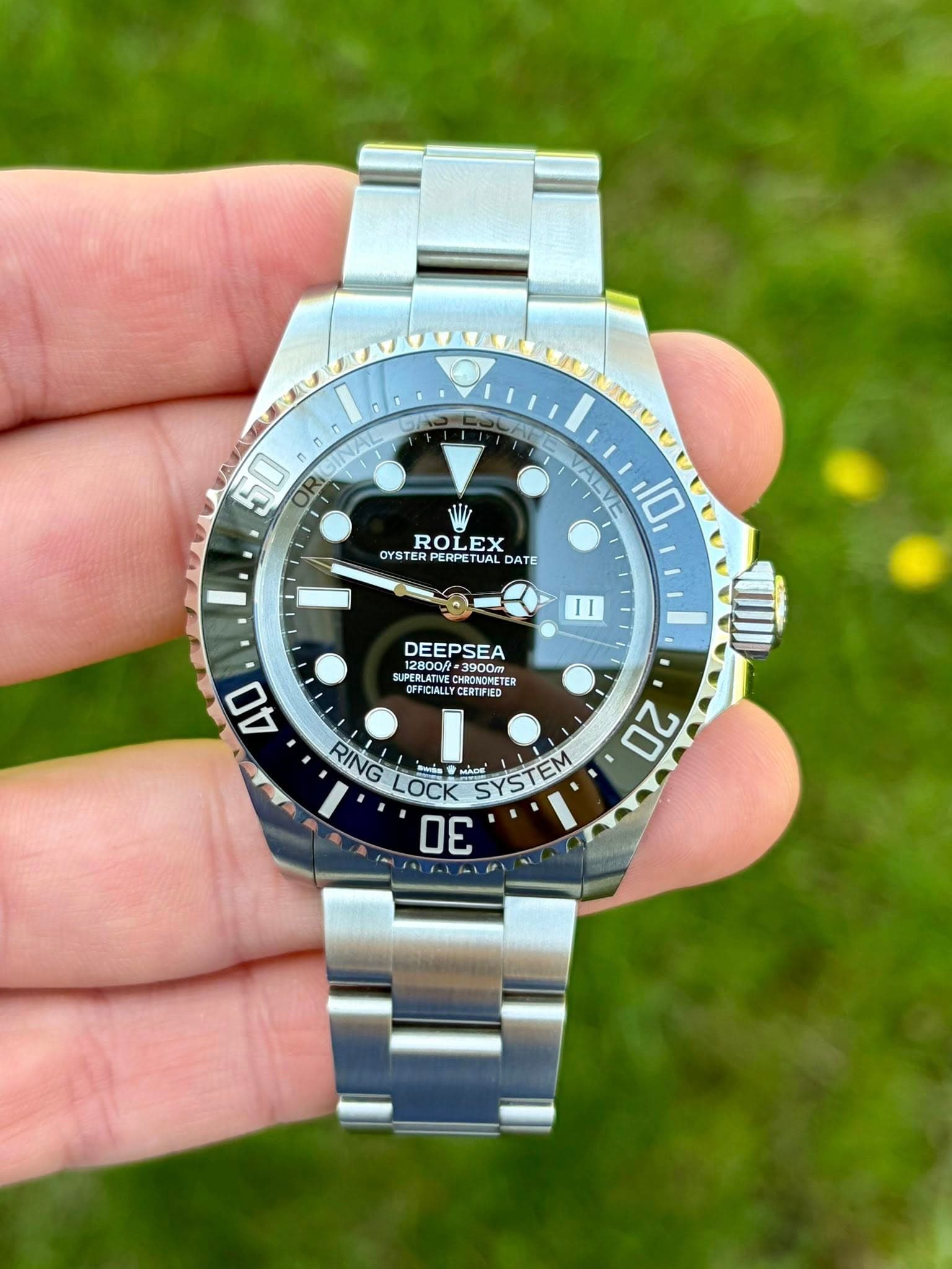 May be an image of wrist watch and text