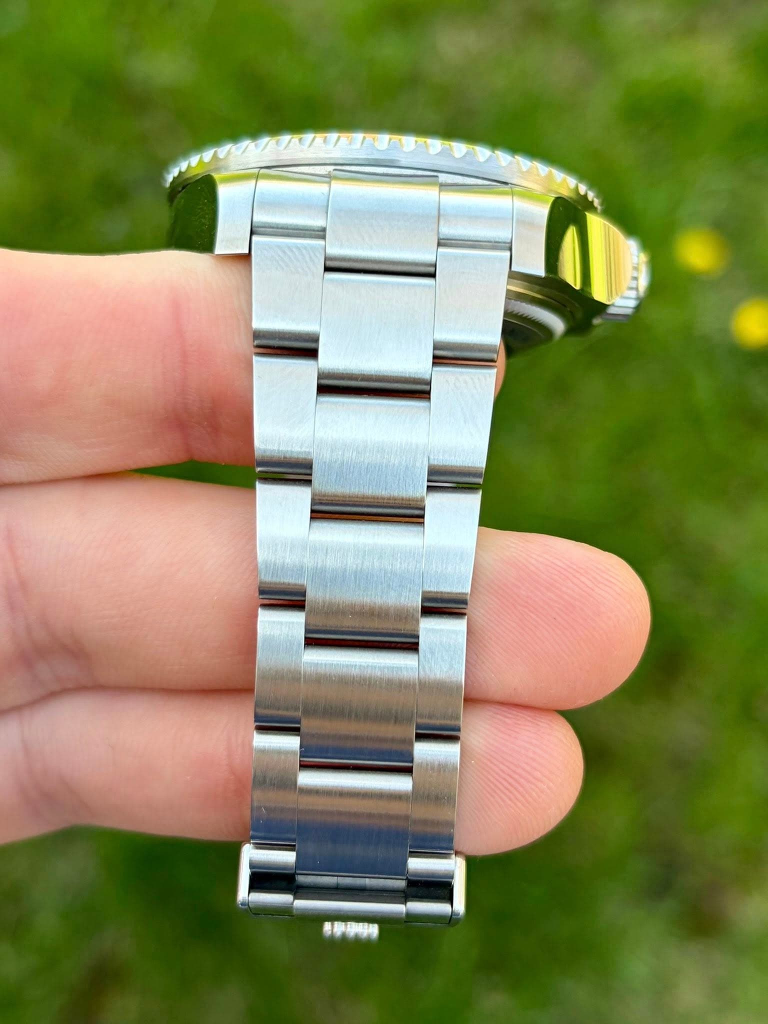May be an image of wrist watch and text