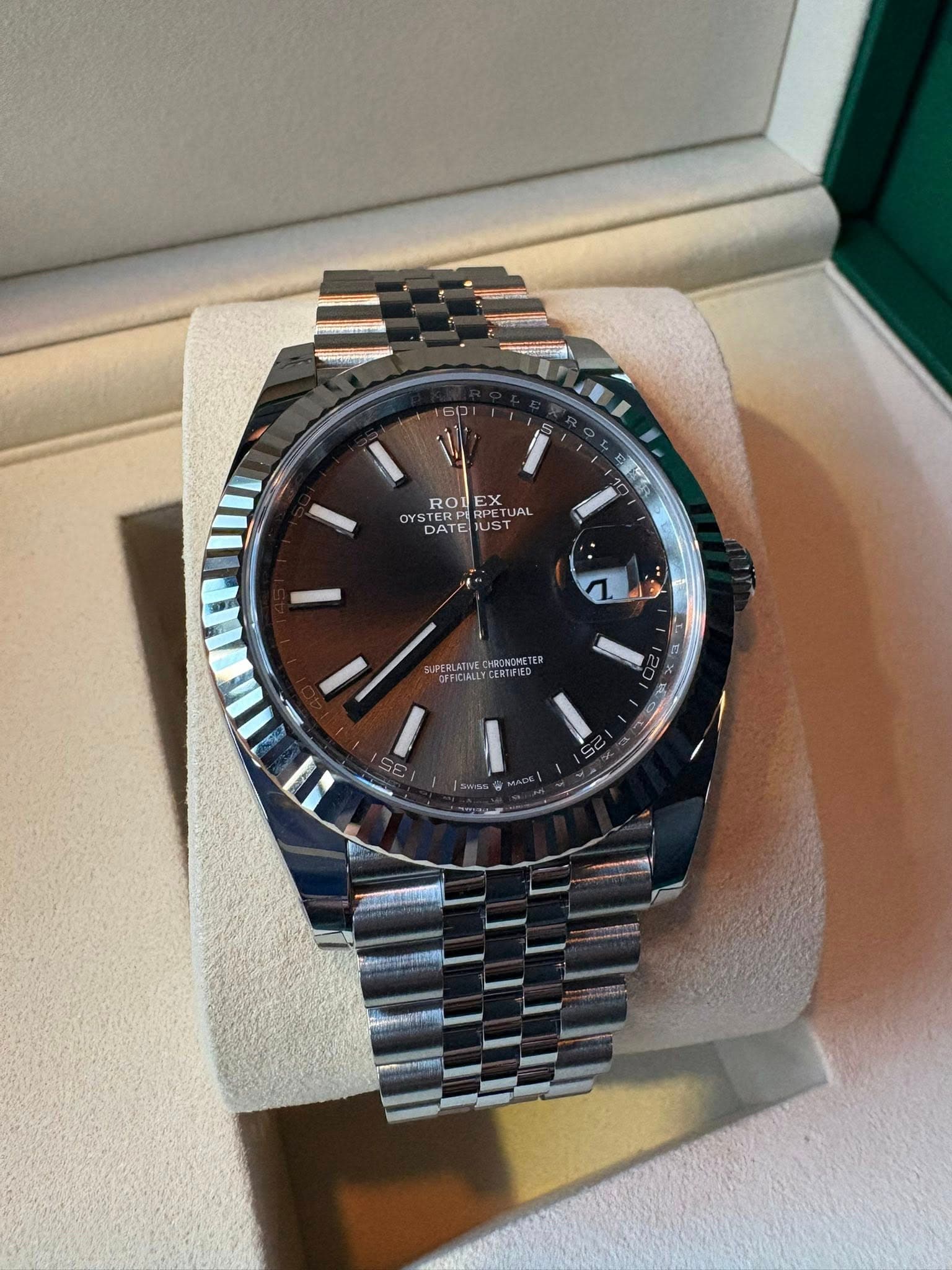 May be an image of wrist watch and text