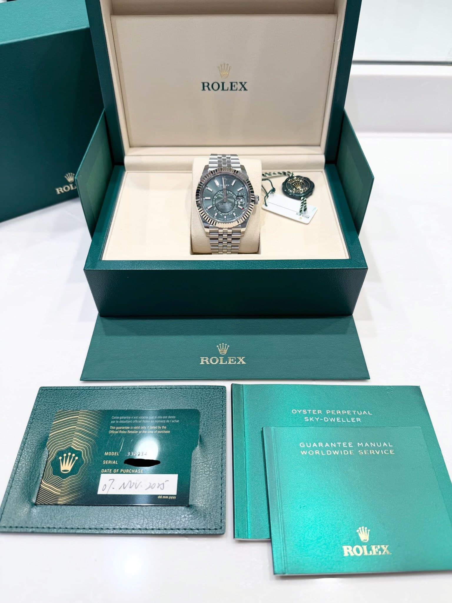 May be an image of wrist watch and text that says 'ROLEX ROL ストクオン យ W ROLEX MODEL SERIAL 336234 OYSTERPERPETUAL OYSTER PERPETUAL SKY-DWELLER DATE BATEOFFURCHASE PURCHA 07. NV…
