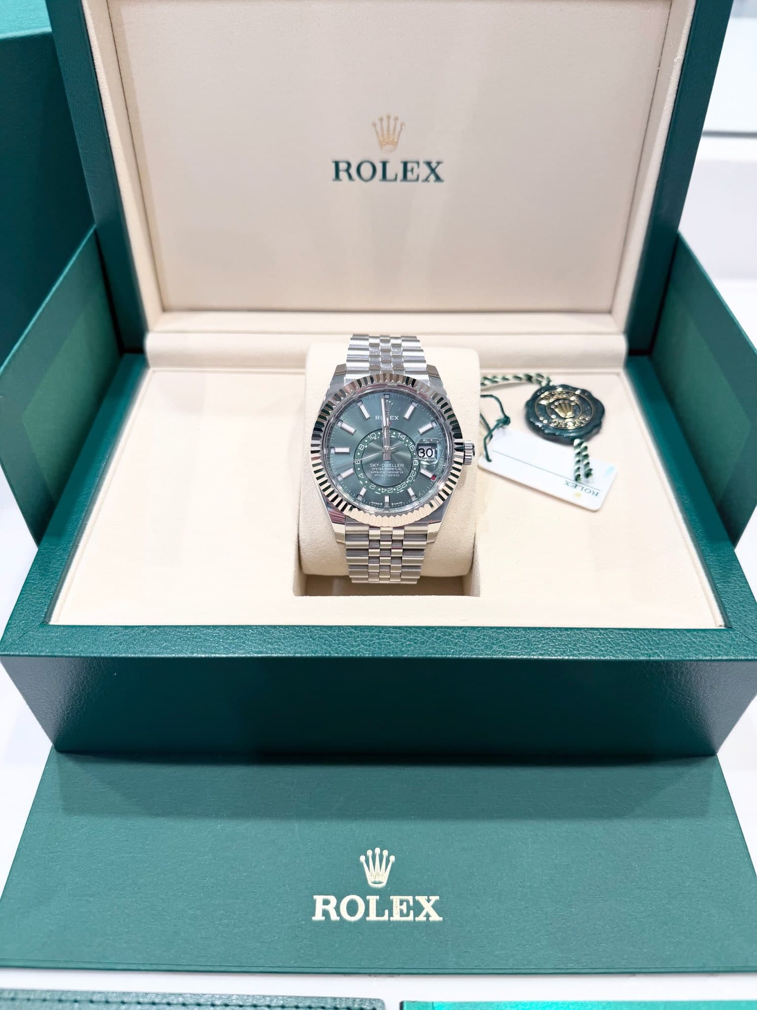 May be an image of wrist watch and text