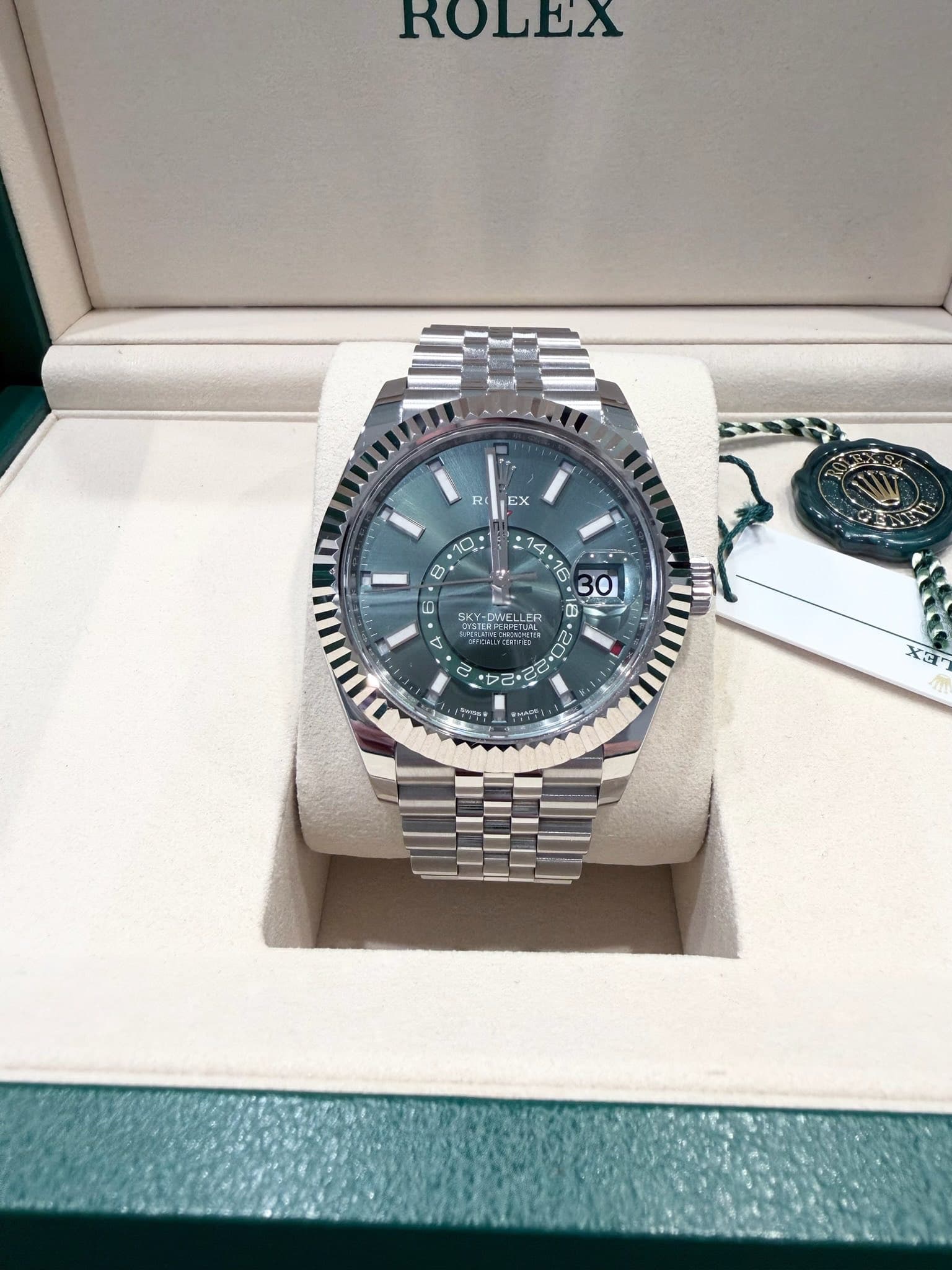 May be an image of wrist watch and text
