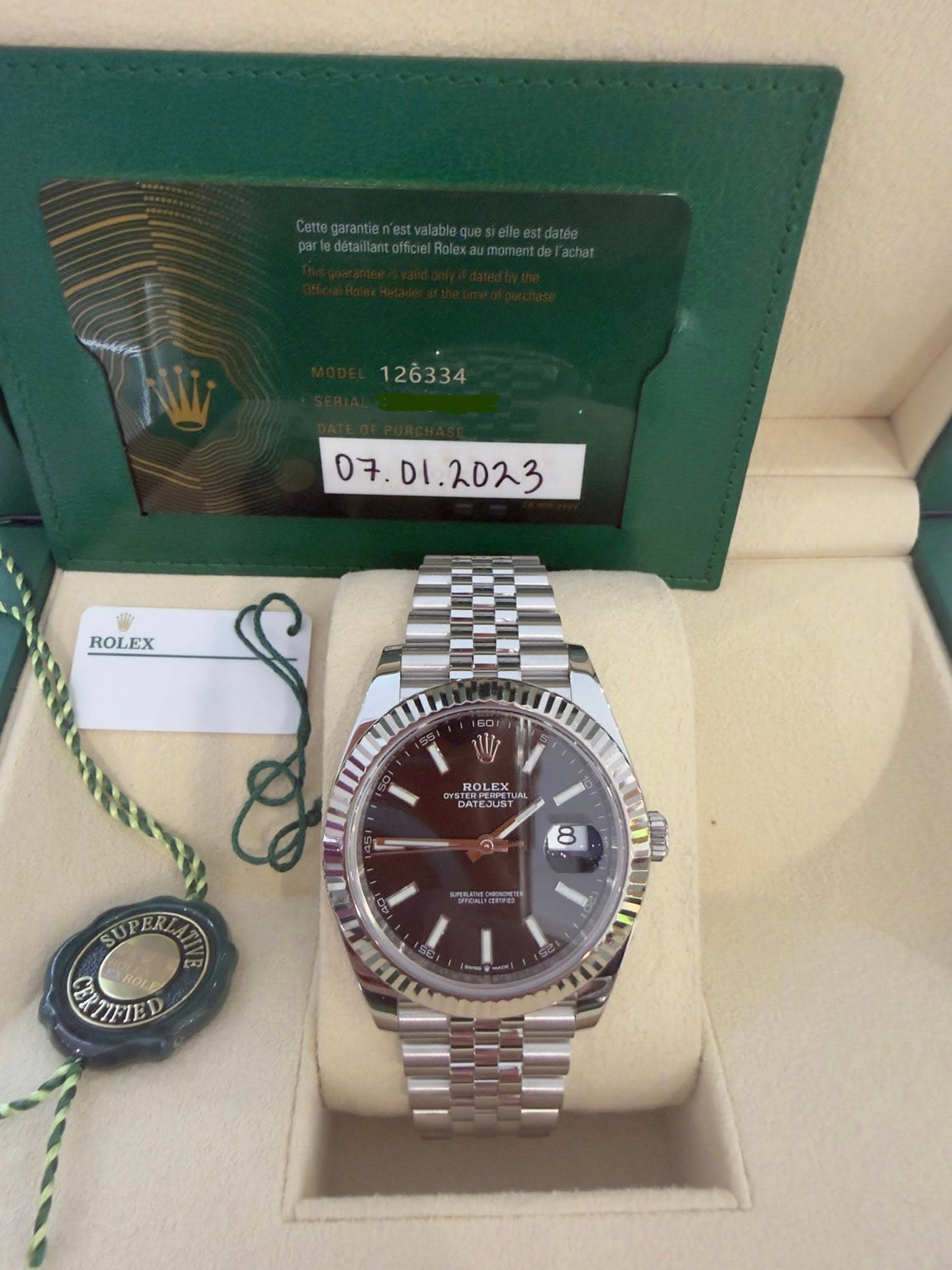 May be an image of wrist watch and text