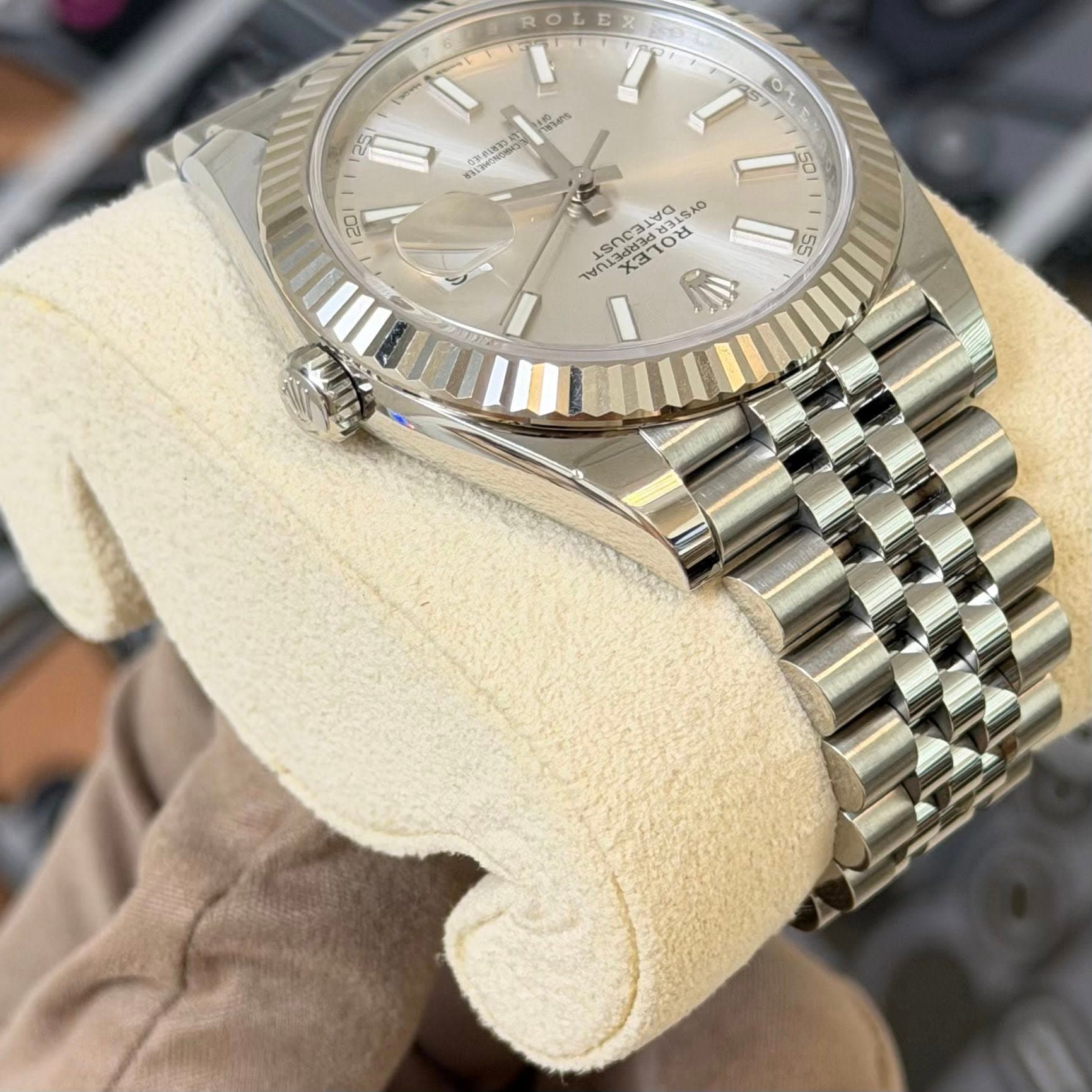 May be an image of wrist watch and text
