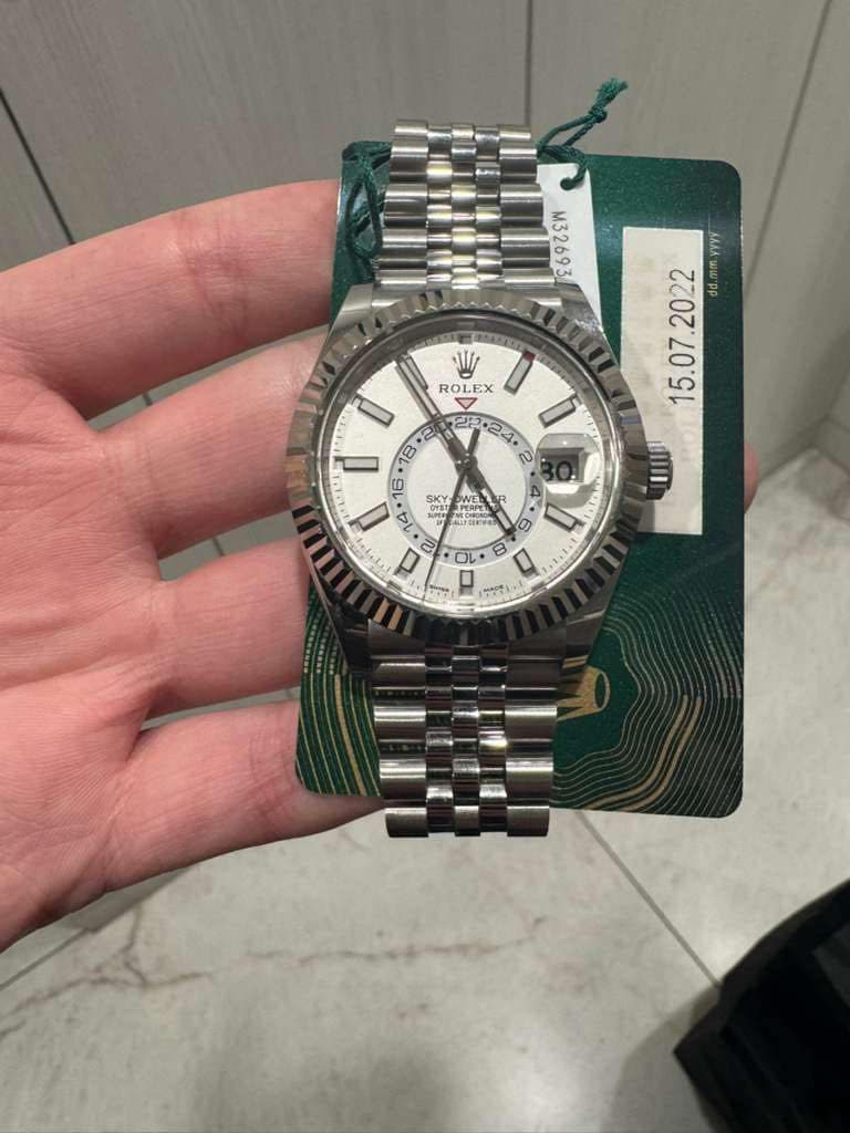 May be an image of wrist watch and text