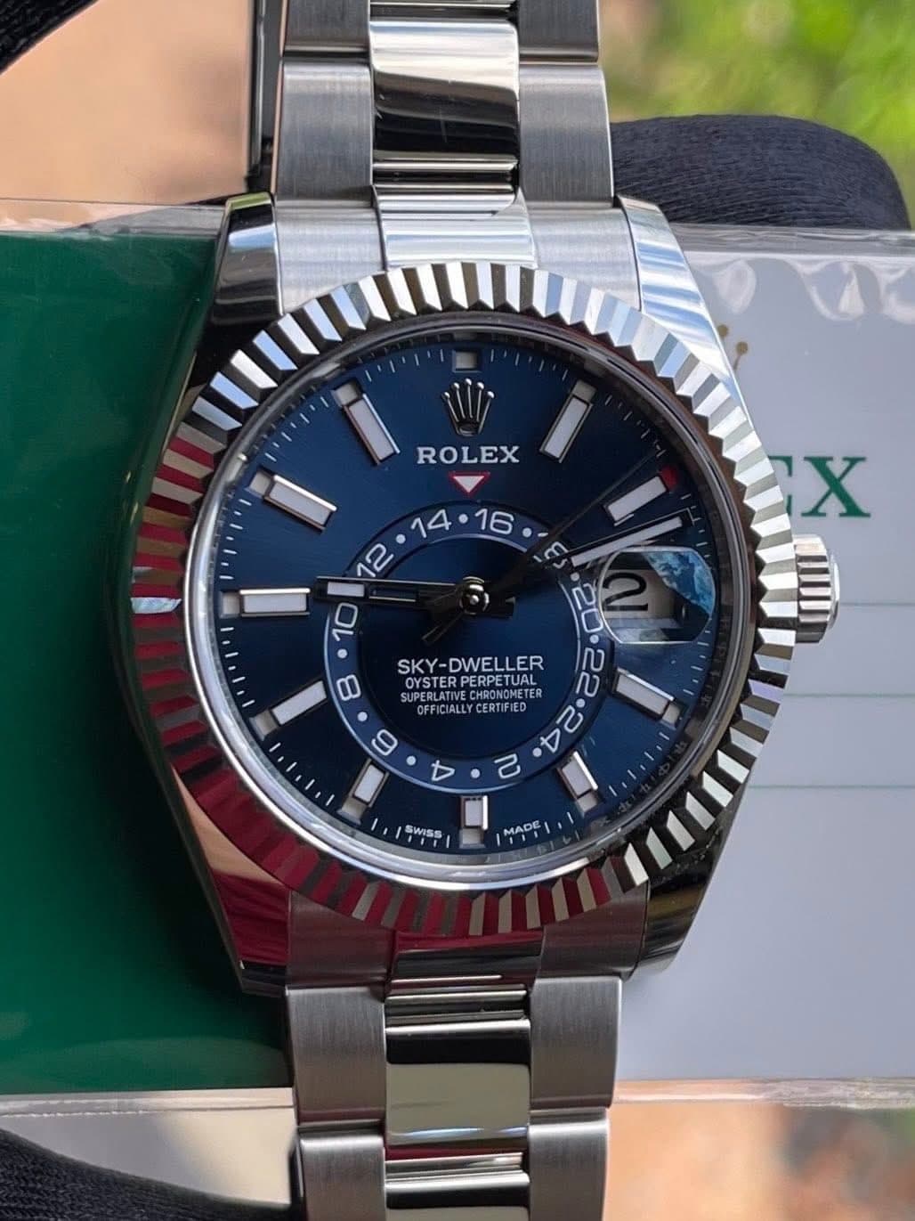 May be an image of wrist watch and text that says 'X ROLEX ላይላ4፡ገ፡ል። SKY KY-DWELLER 0 SUPERLATINECHRONGMETE OYSTERP SUPEBLATIVE OEFICIALL TVEC OYSTERPERPETURE ERPETUAL OYSTER…