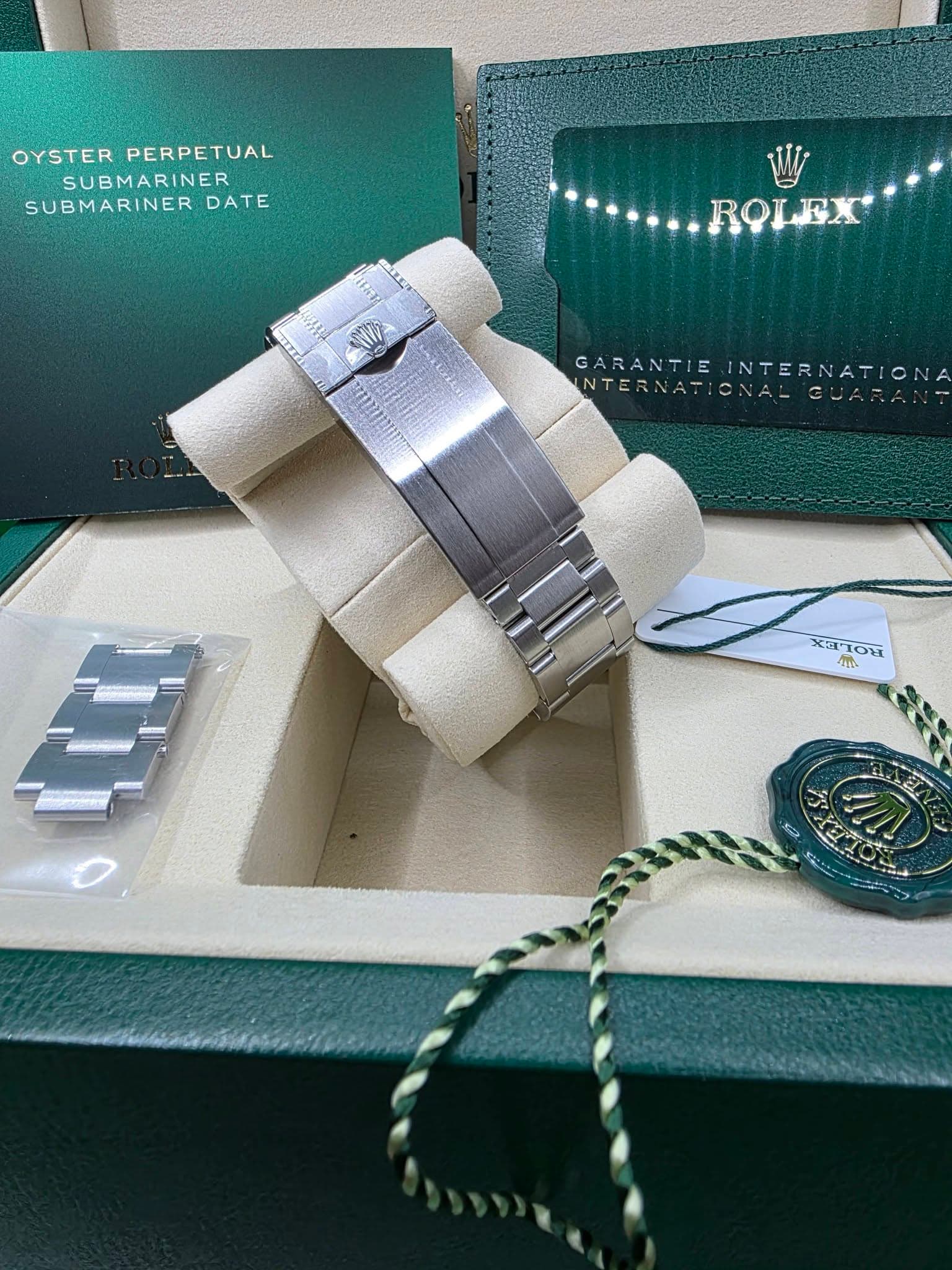 May be an image of wrist watch, jewelry, napkin ring and text