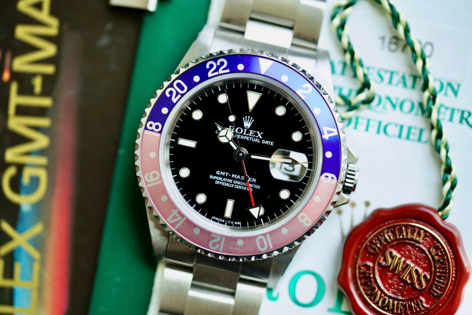 May be an image of wrist watch and text that says ' OLEX MERPETUAL DATE ਤ 1oh STATION Ο STAT NOMETR CTR ONOM 4 F TTICIEDO ICIED យហ 16 SUPERLATIVE SUPERLATIY GMT- MAS CHSDN S ER…