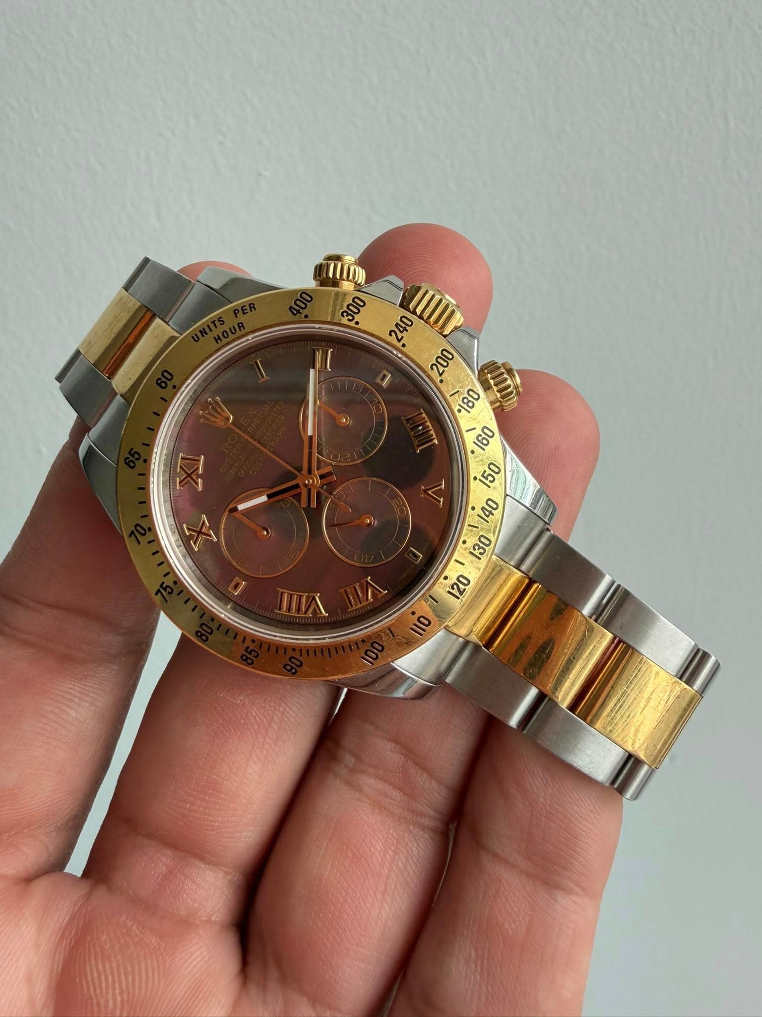 May be an image of wrist watch and text