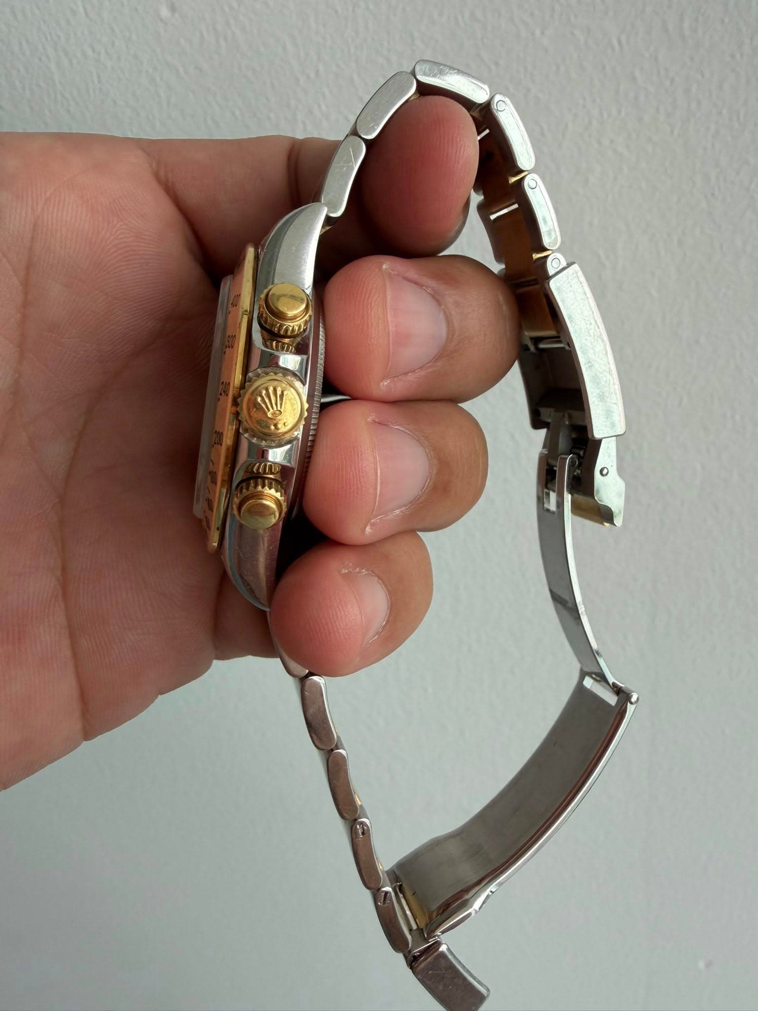 May be an image of brass, jewelry and wrist watch