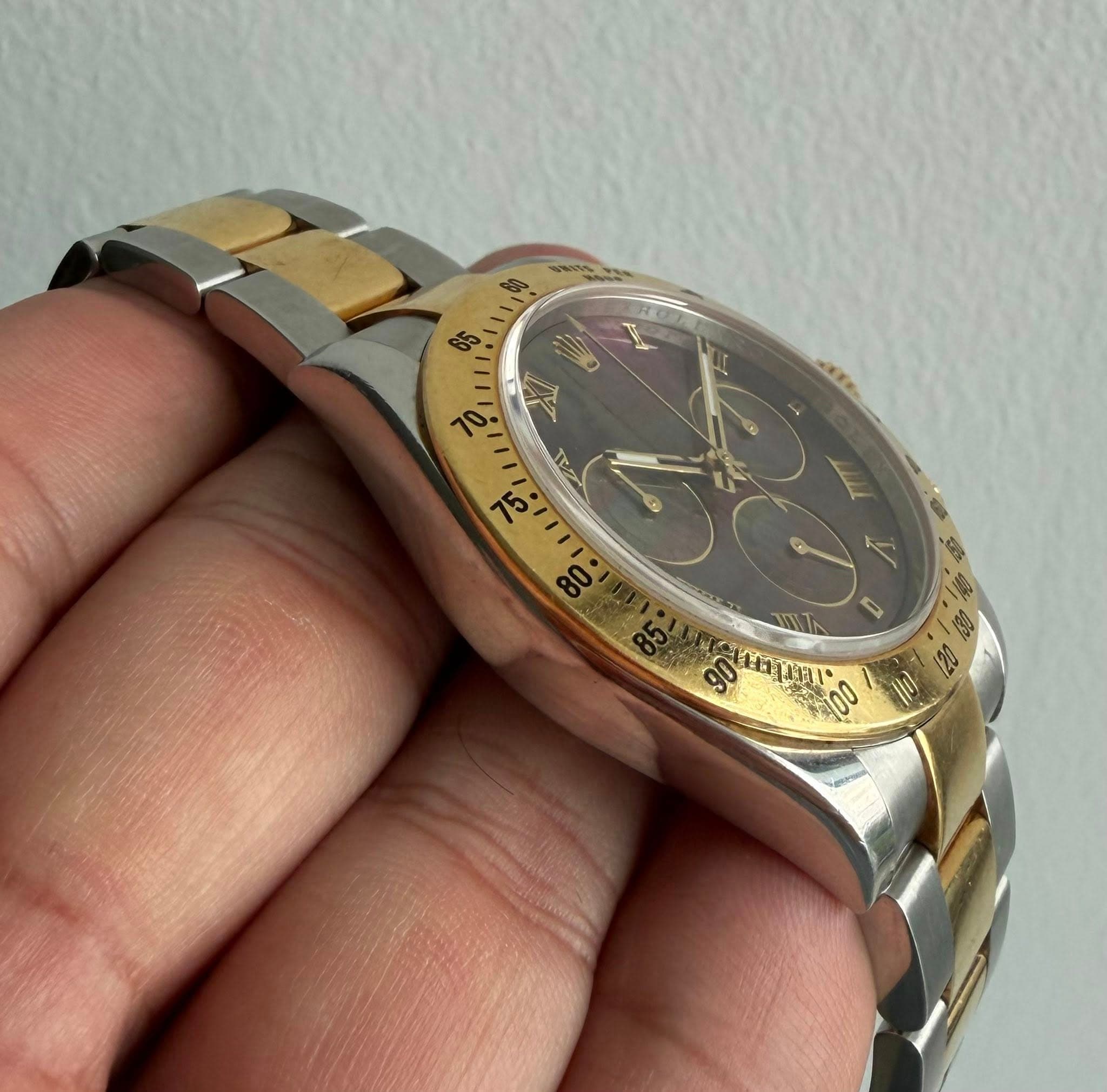 May be an image of wrist watch and text