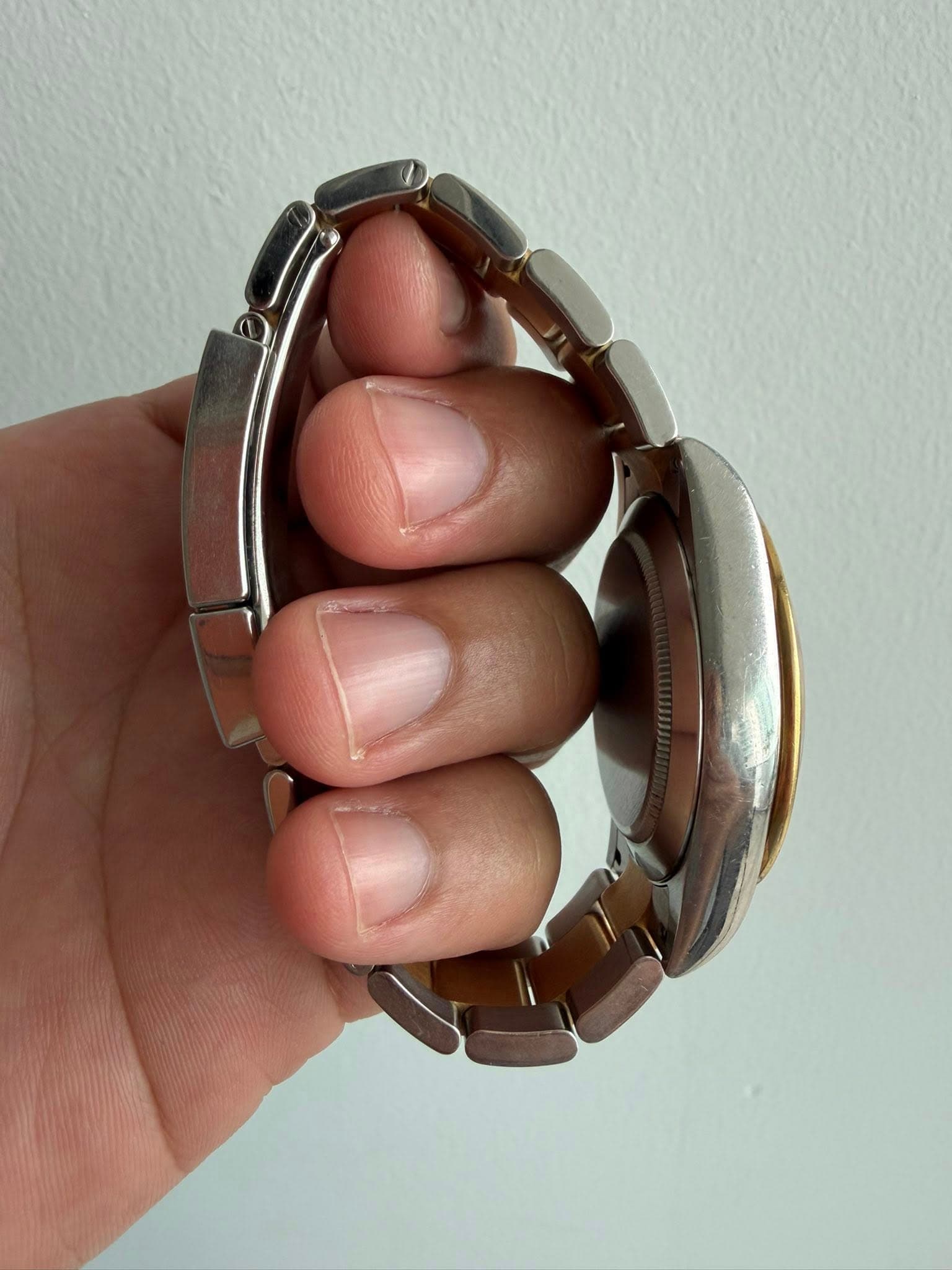 May be an image of wrist watch and jewelry