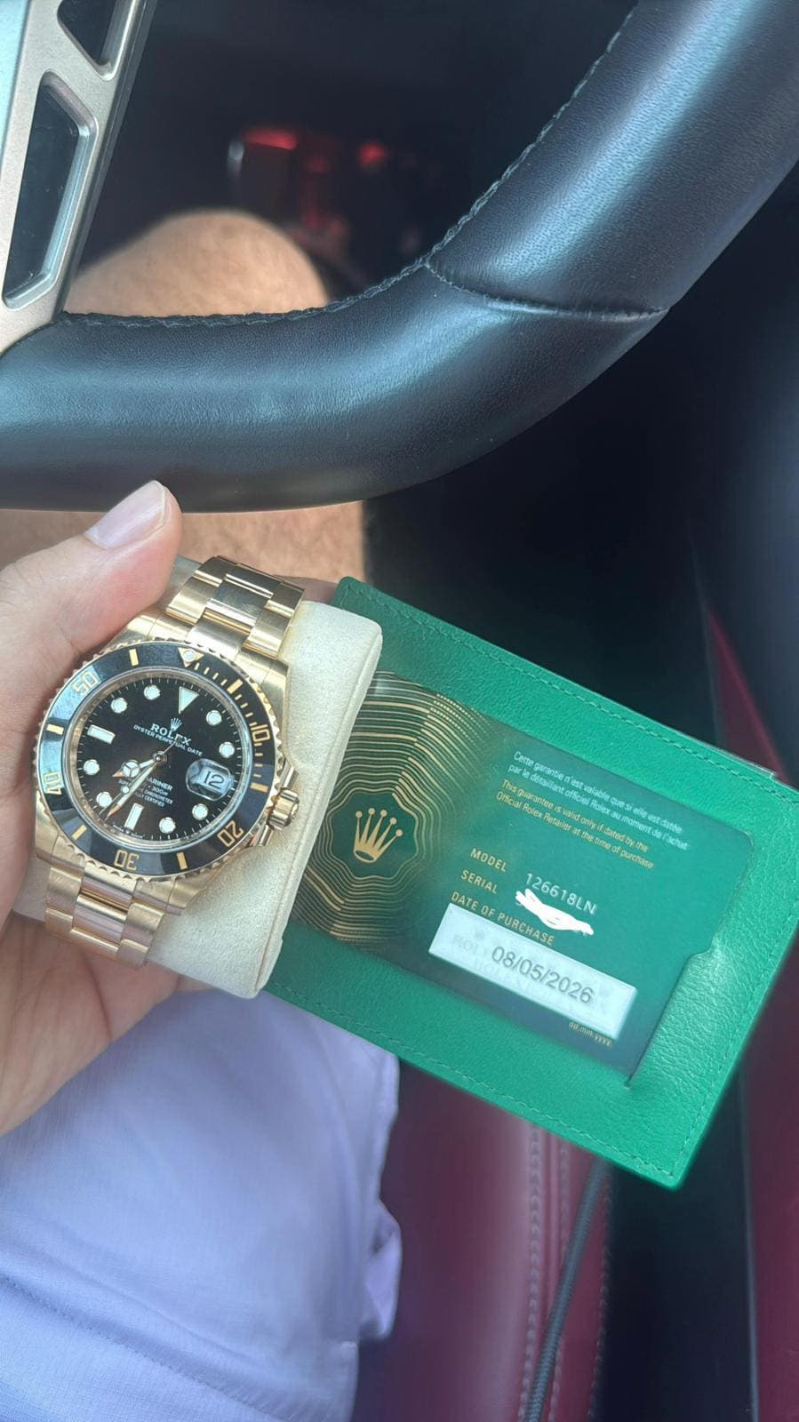 May be an image of wrist watch and text