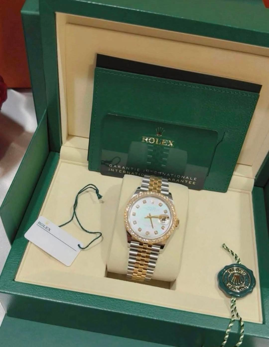 May be an image of wrist watch and text that says 'ROLEX INTER GARA Ro ROLEX EX 6 R G E ® G'