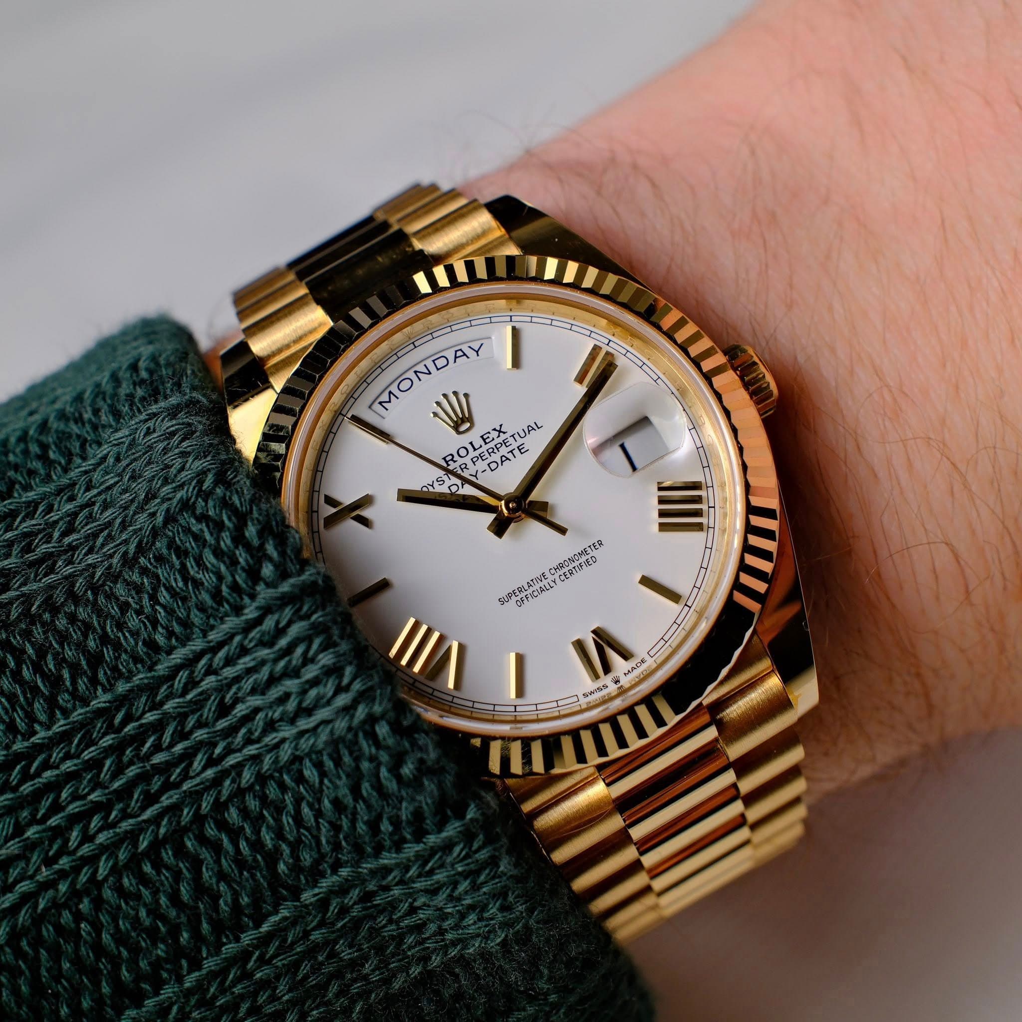 May be an image of wrist watch and text