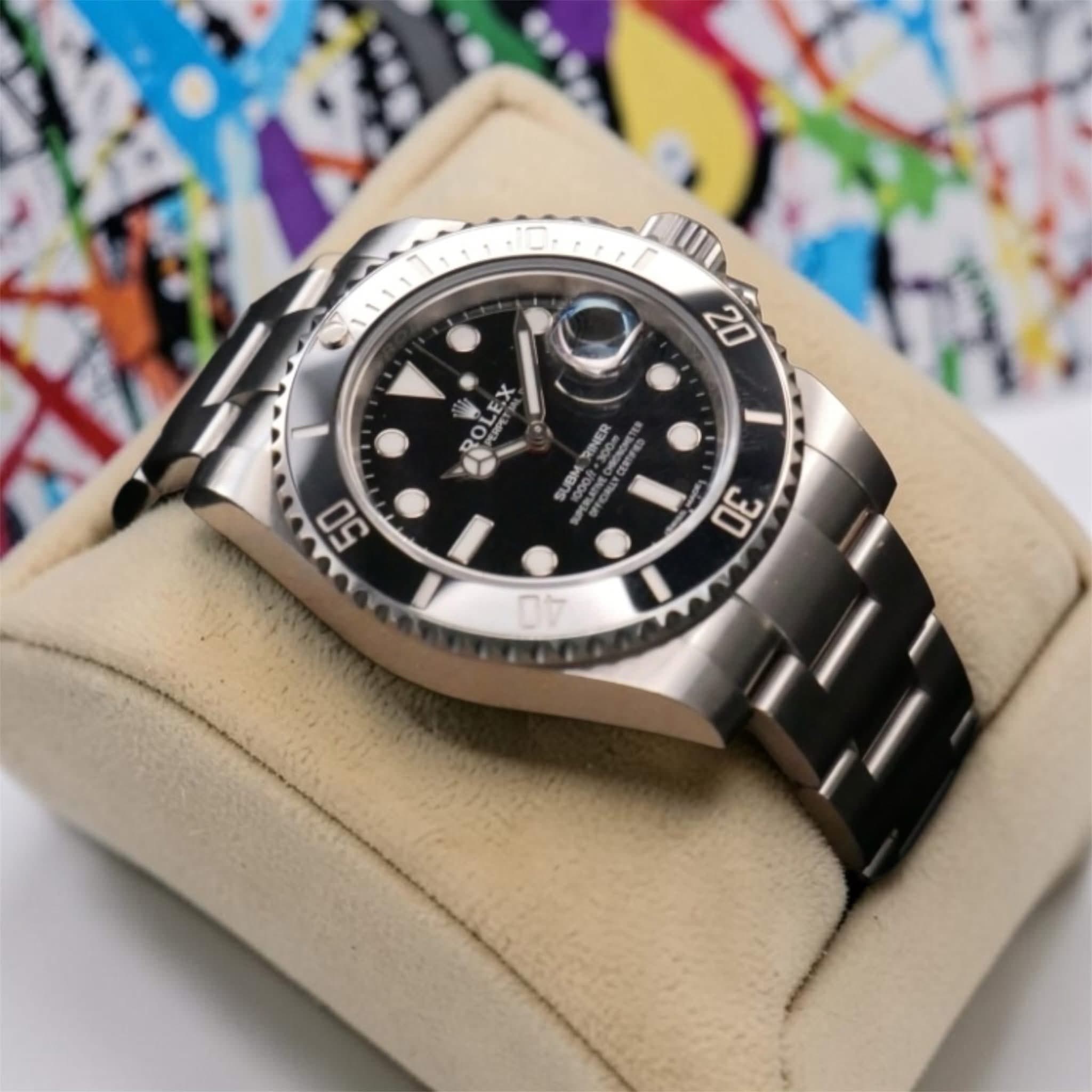 May be an image of wrist watch and text that says '20 OLEX OL ቢ X س ROLLE RINER PMER 100m ONEN SUBM 50 30 I 무'