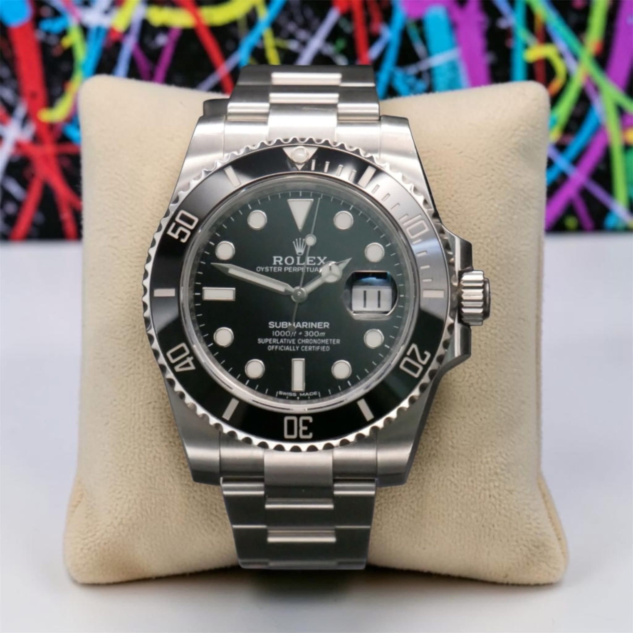 May be an image of wrist watch and text that says '50 D E 10 YSTERPE STERPERPETUN ROLEX ROLEX 11 SUBHIARINER SUB ARINER CERTIFIED NII 40 20 2ስ'