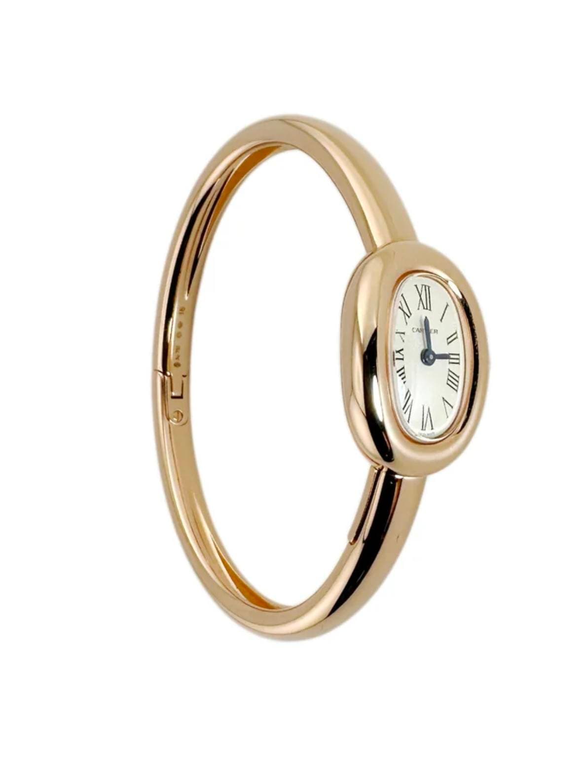 May be an image of wrist watch, jewelry and text that says 'XII R I T I A IA Y L ill V VI'