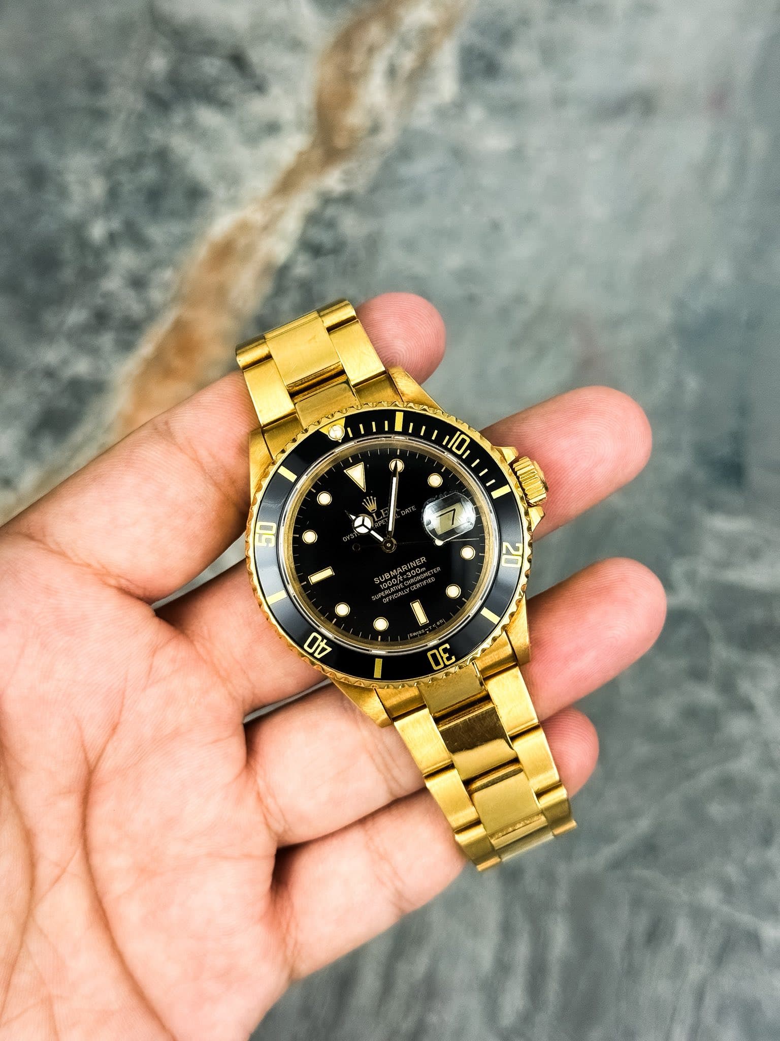 May be an image of wrist watch and text