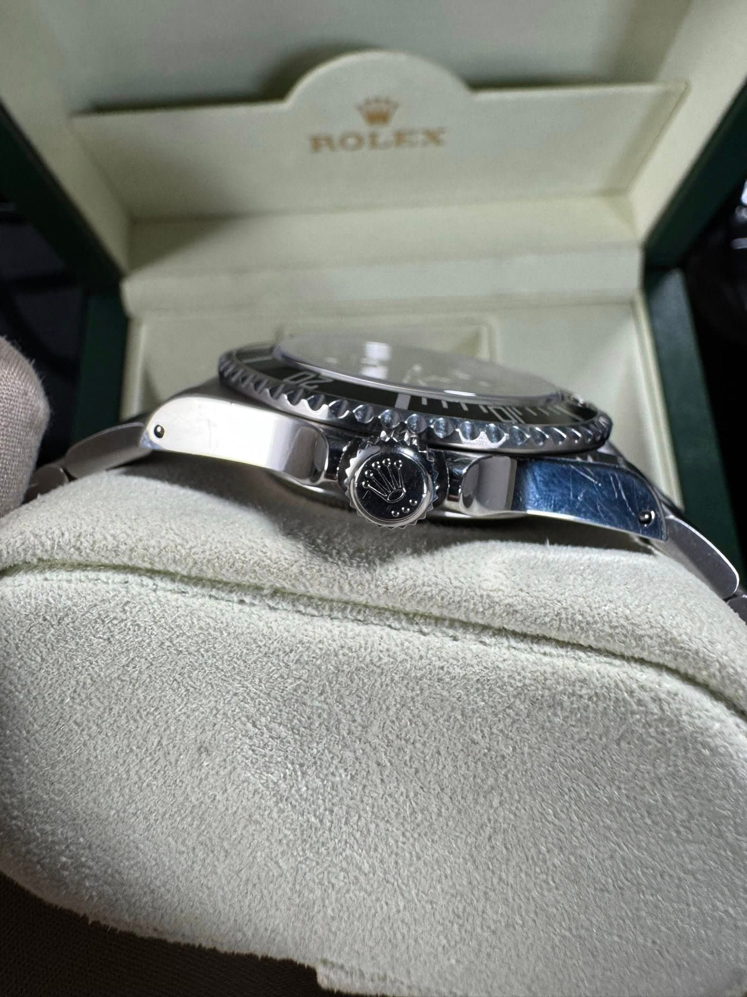 May be an image of wrist watch and text that says 'ROLEX'