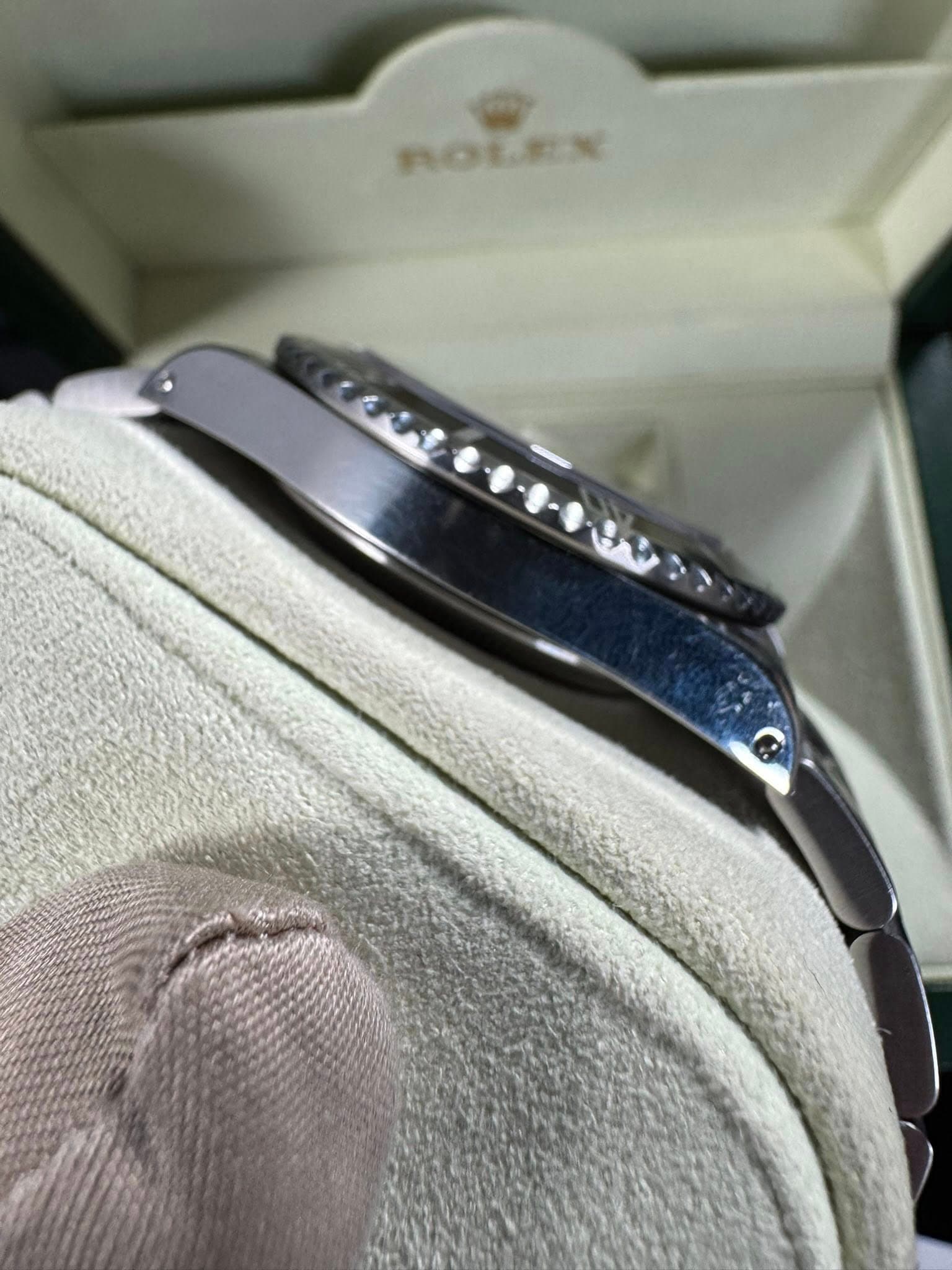 May be an image of wrist watch and text that says 'ROLEX'