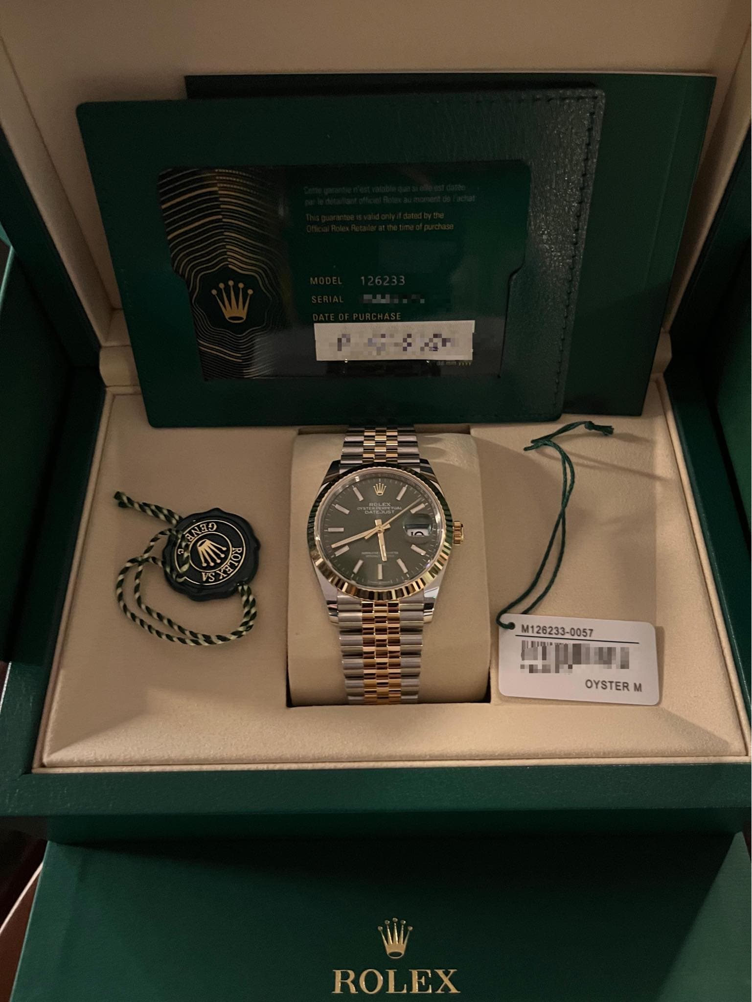May be an image of wrist watch and text that says 'PE ይ ANEO I 108 VS in M126233-0 -0057 小 四川海 ”監品 OYSTER M ROLEX'
