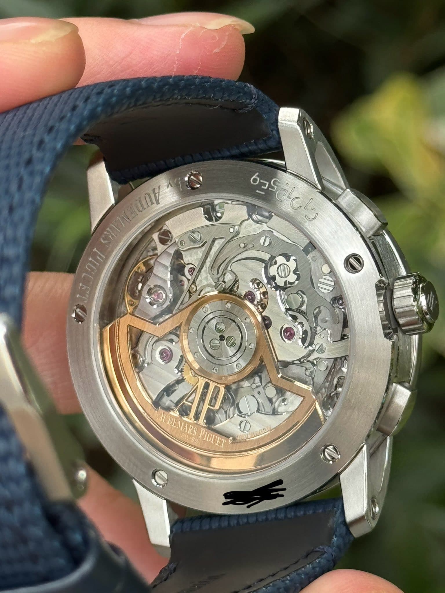 May be an image of wrist watch and text