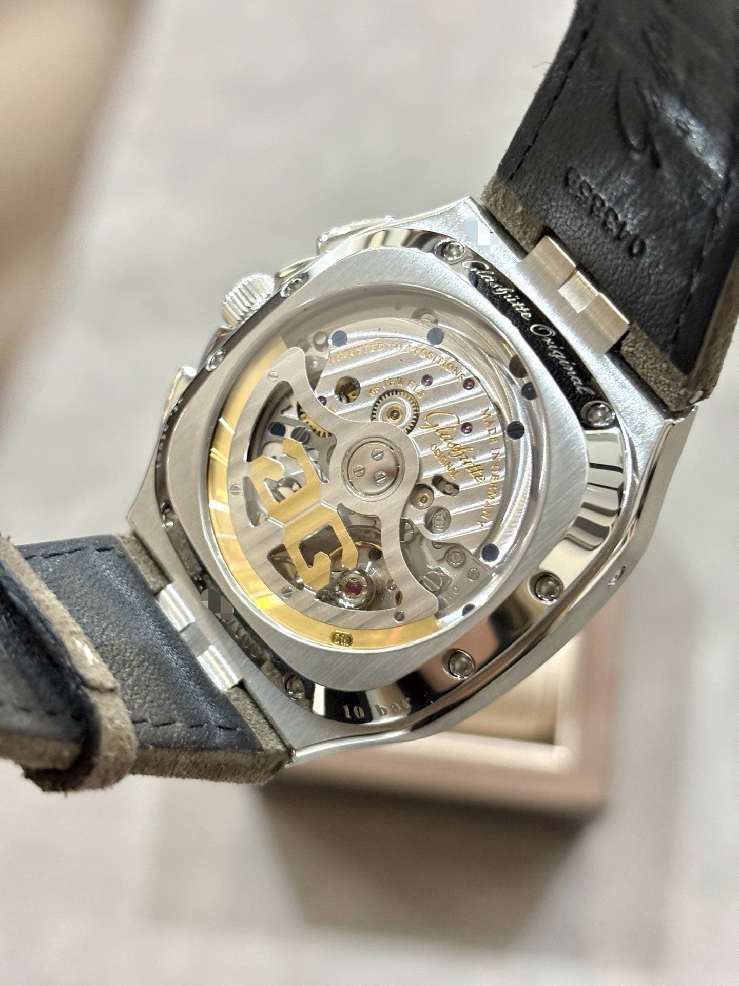 May be an image of wrist watch and text
