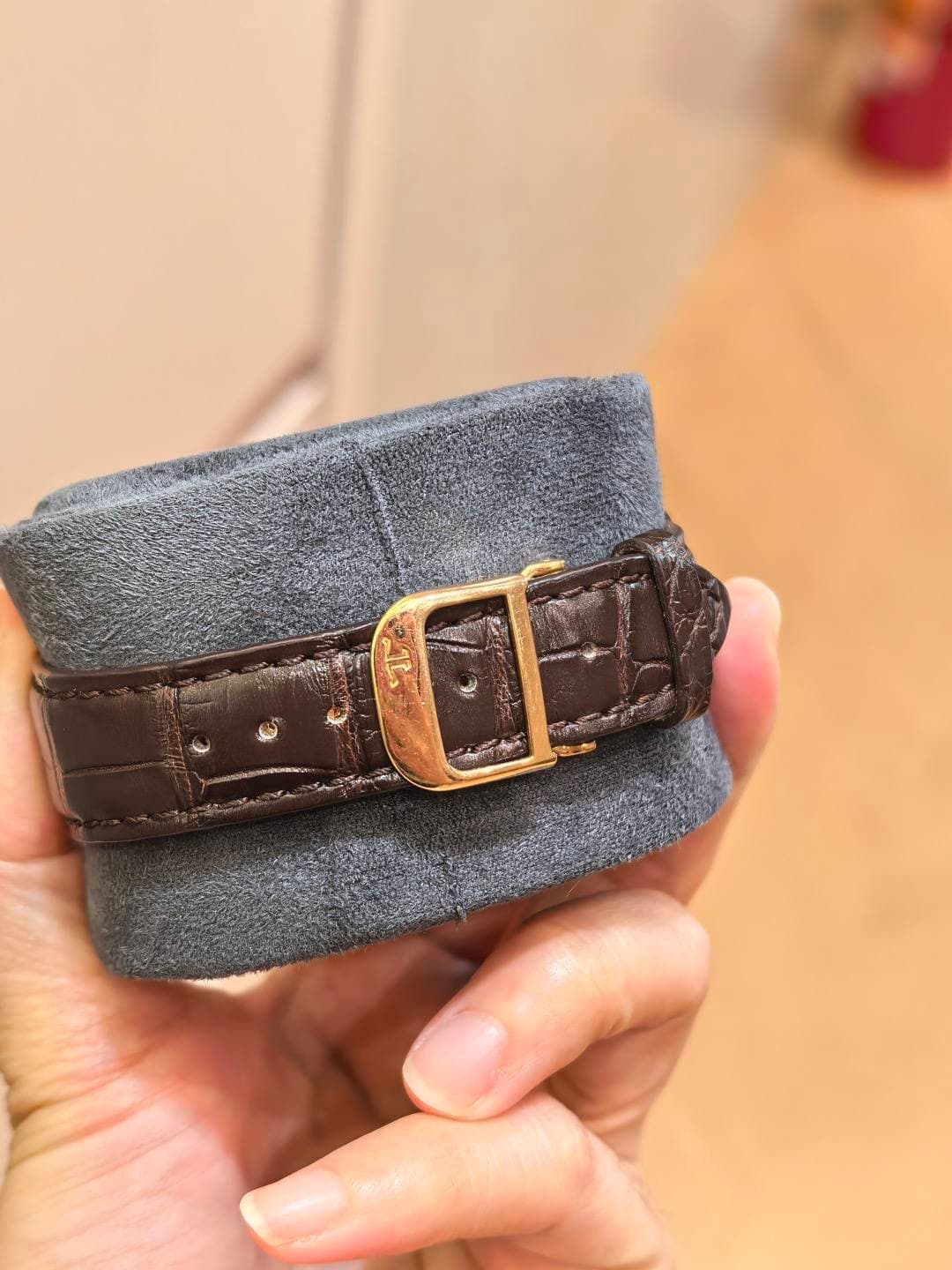May be an image of leather, saddle-stitched leather and wrist watch