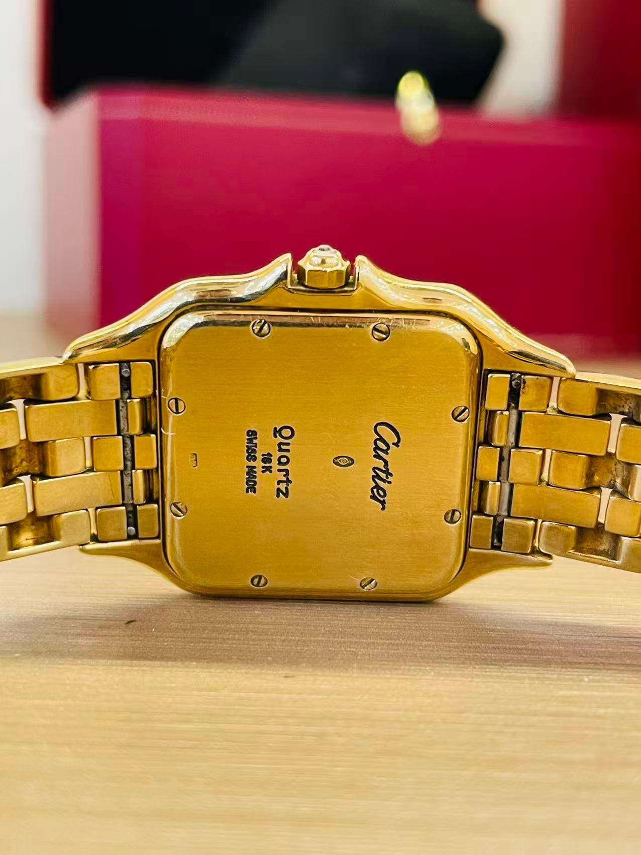 May be an image of wrist watch and text that says '3 중 S9IMS 21 ® Cartier 물 MADE を AИOno MOL ณ zwono'