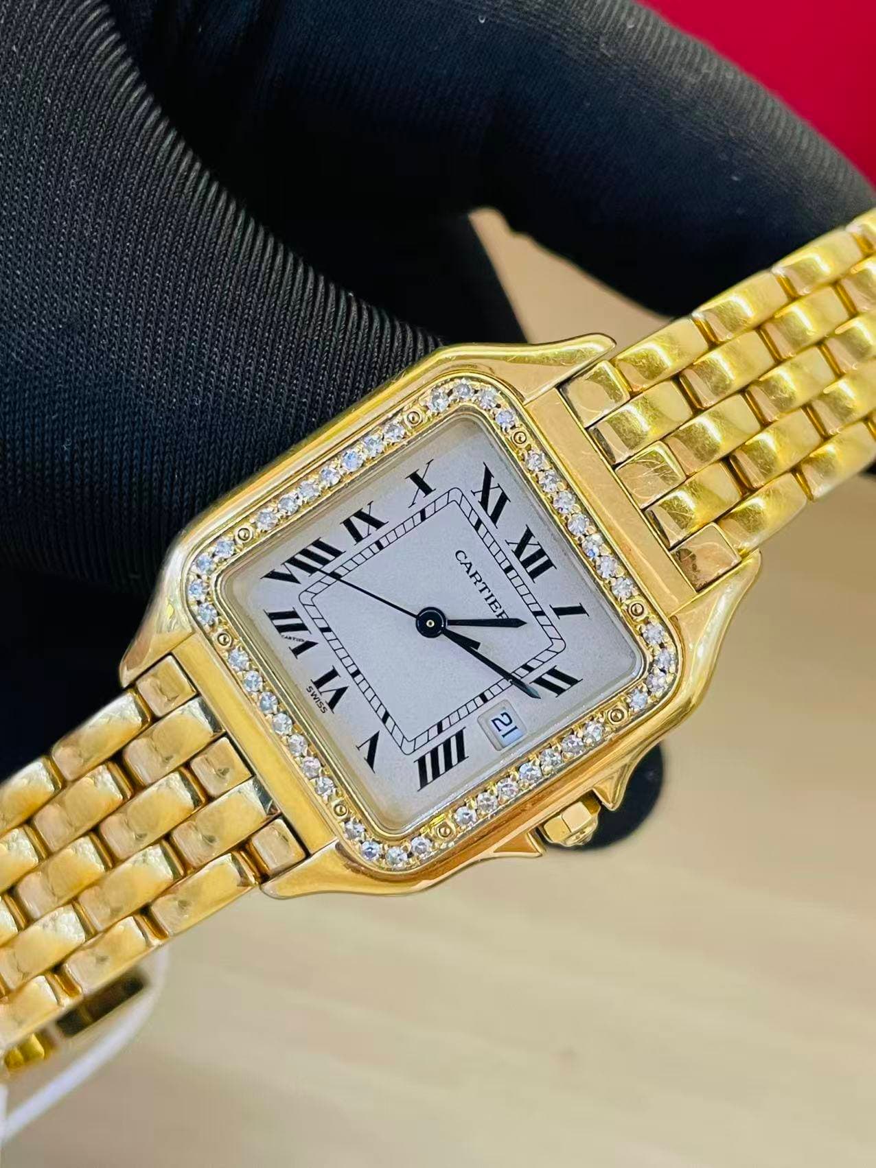 May be an image of wrist watch and text