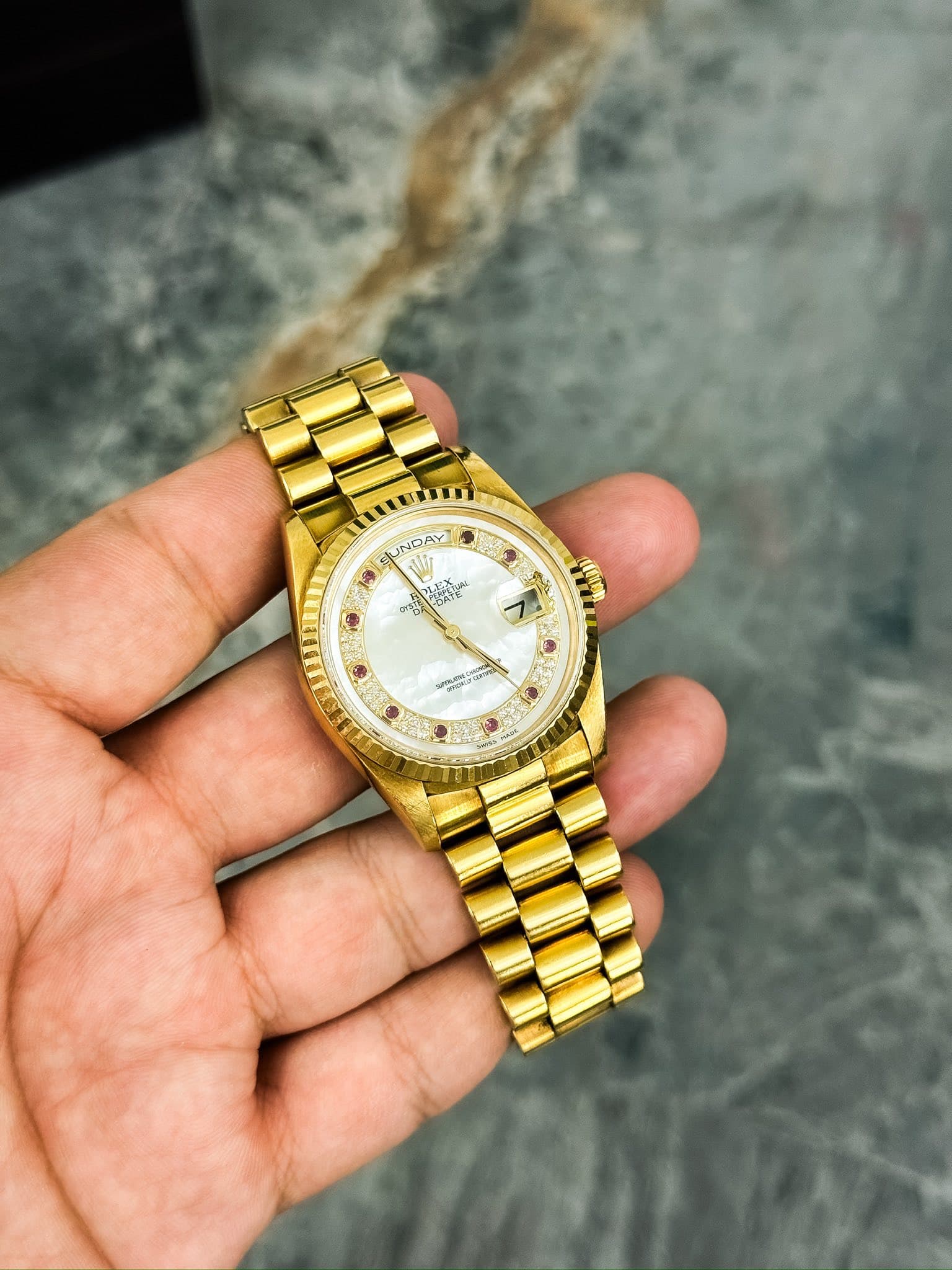 May be an image of wrist watch and text