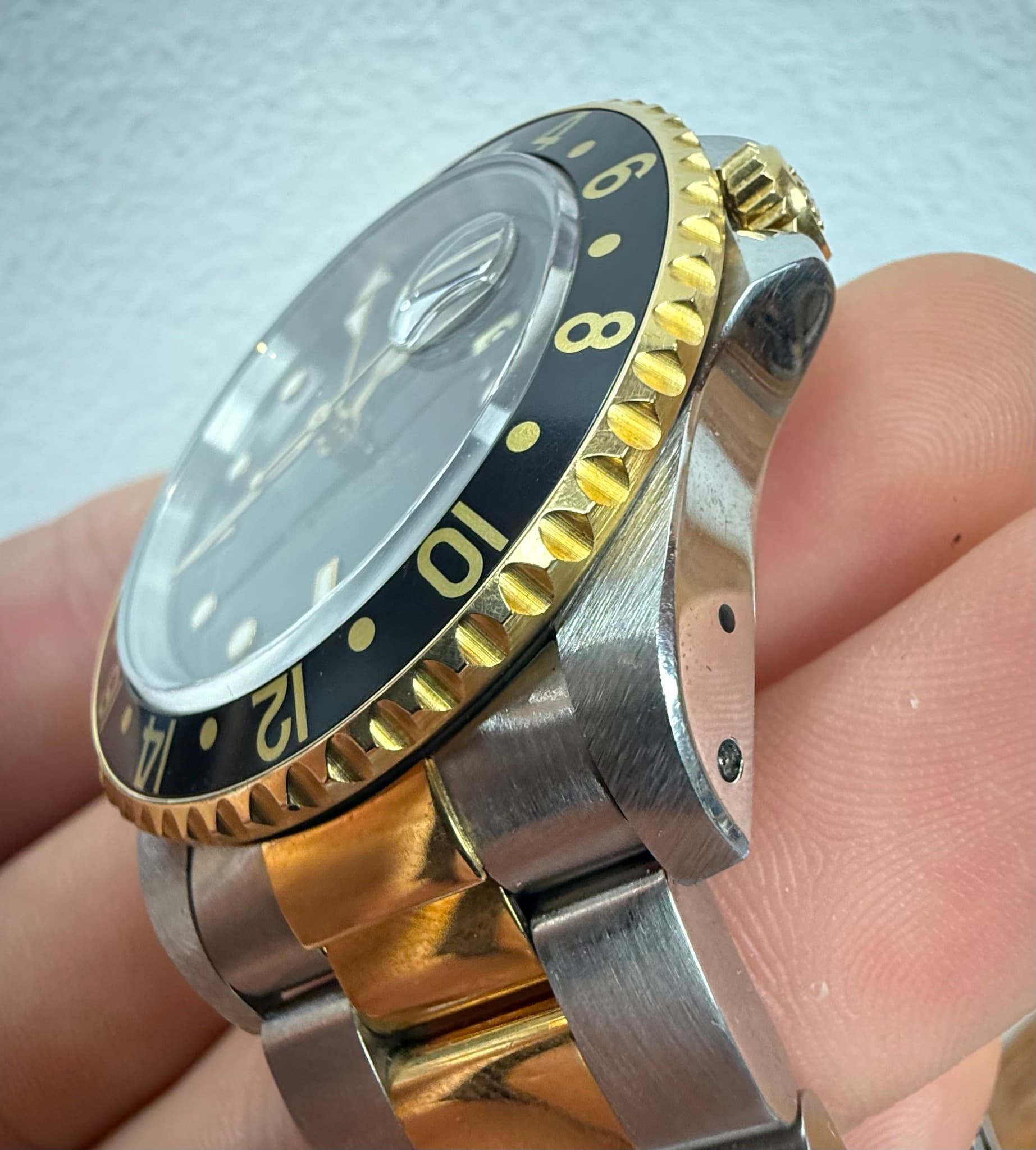 May be an image of wrist watch and text