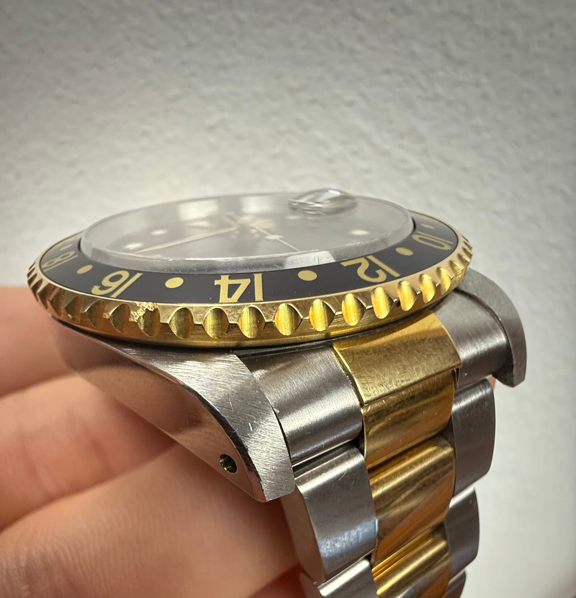May be an image of wrist watch and text