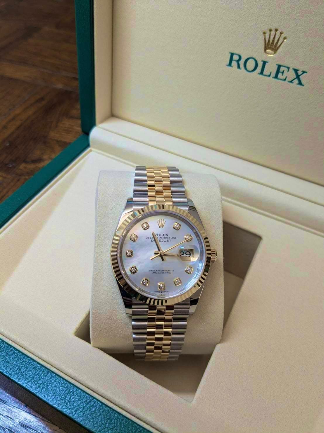 May be an image of wrist watch and text